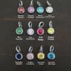 Silver oxidized 6mm Birthstone Charm shown on dark background
