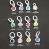 Silver shiny 4mm Birthstone Charms shown on dark background