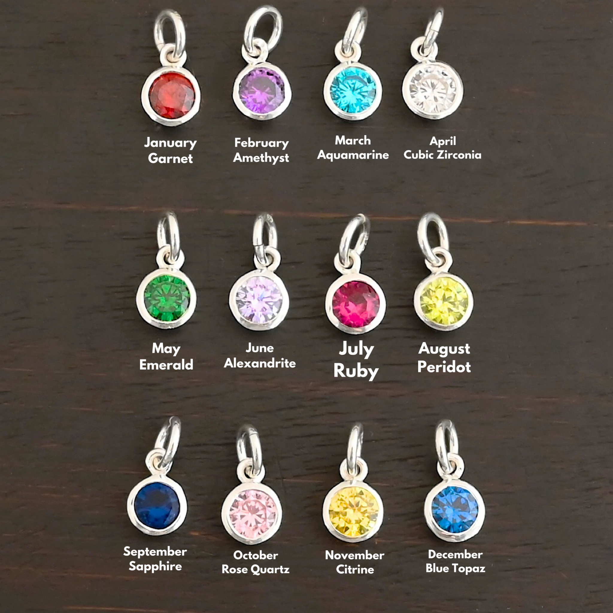 Silver 6mm Birthstone Shiny Silver 6mm Birthstone Charm shown on dark background