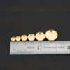 14k gold bezel cups shown by ruler