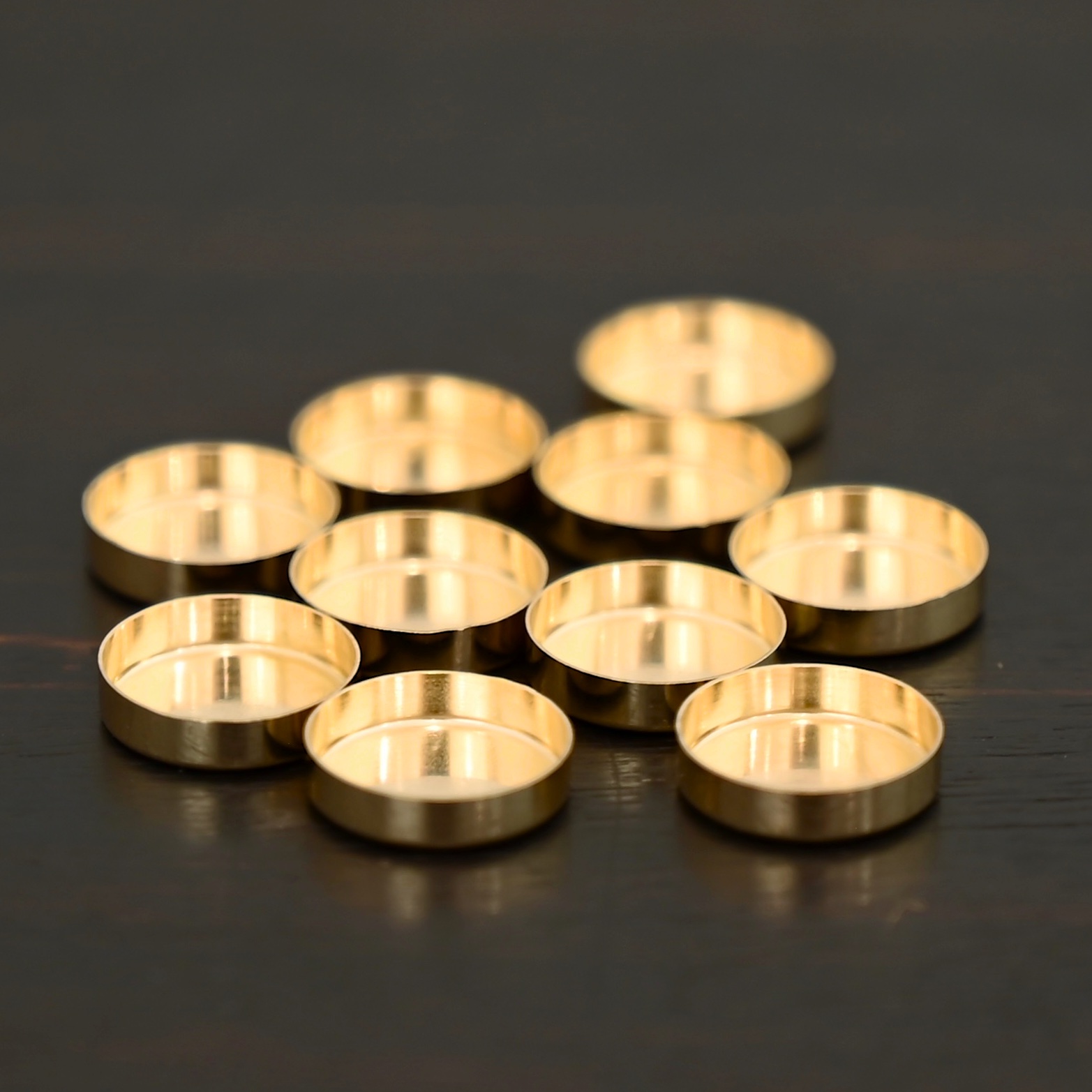 14k gold bezel cups shown on dark background