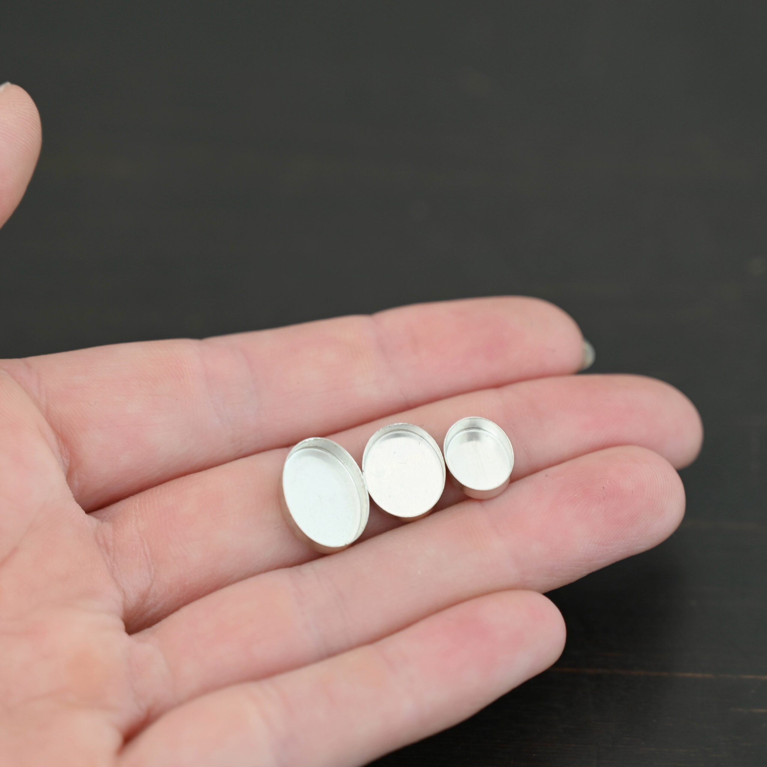 Tall Wall Oval Bezel Cup - shiny shown in hand