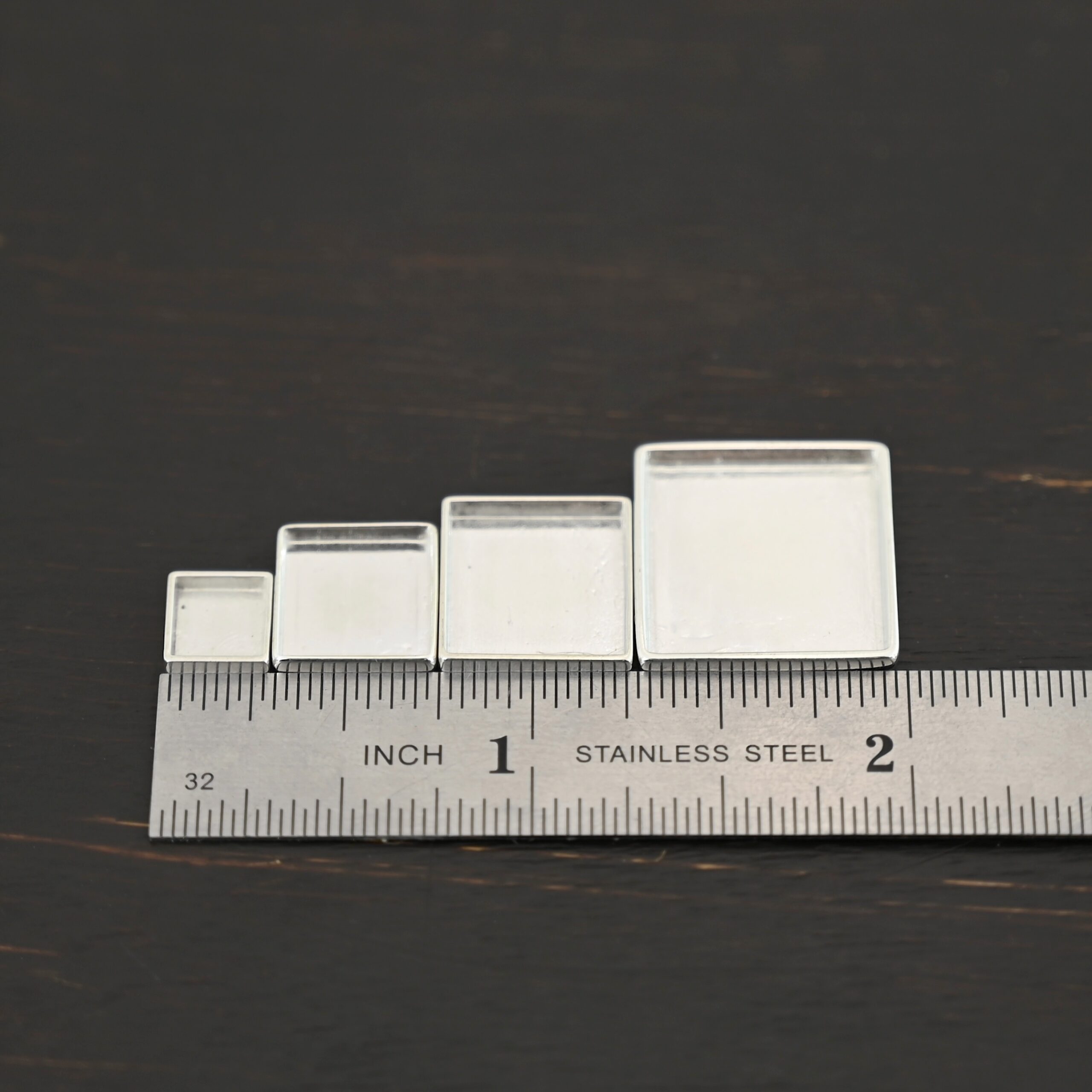 Thick square bezel cups - shiny Thick square bezel cups - shiny shown by ruler