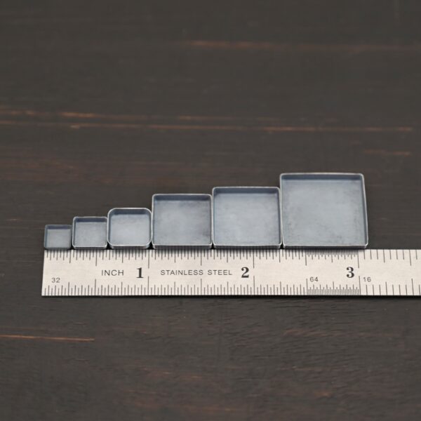 square bezel cups - oxidized shown by ruler