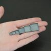 square bezel cups - oxidized shown in hand
