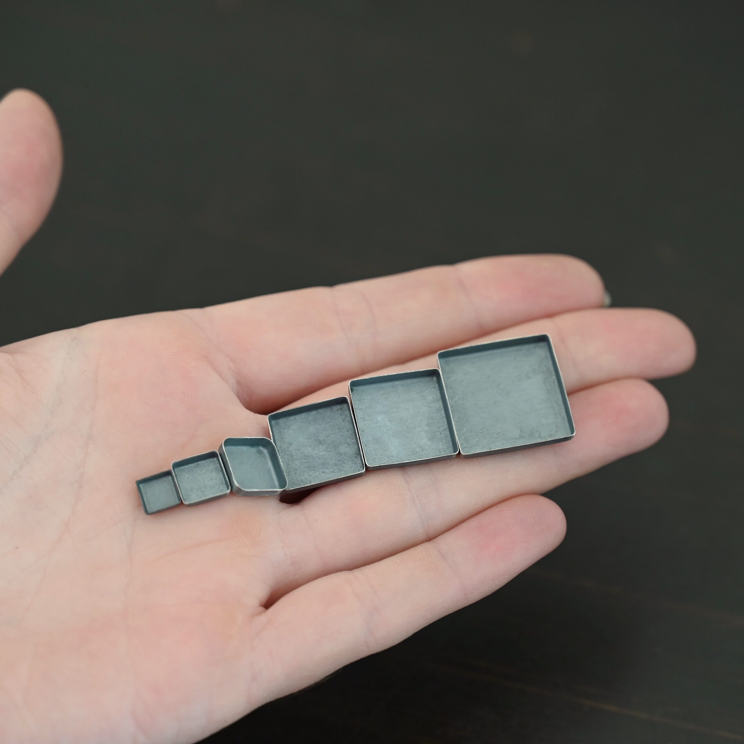 square bezel cups - oxidized square bezel cups - oxidized shown in hand