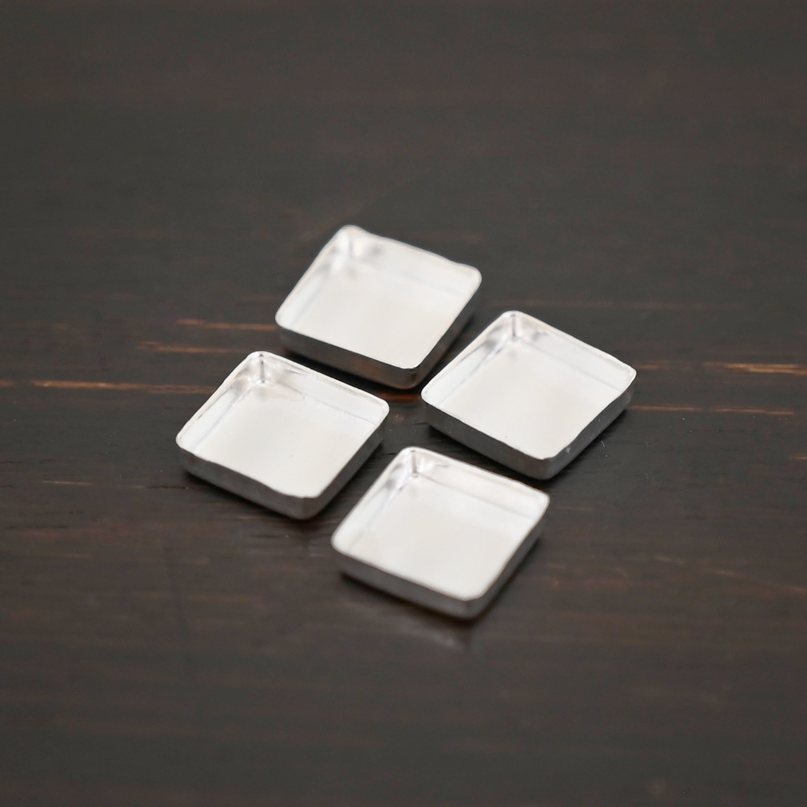 square bezel cups - shiny square bezel cups - shiny shown on dark background