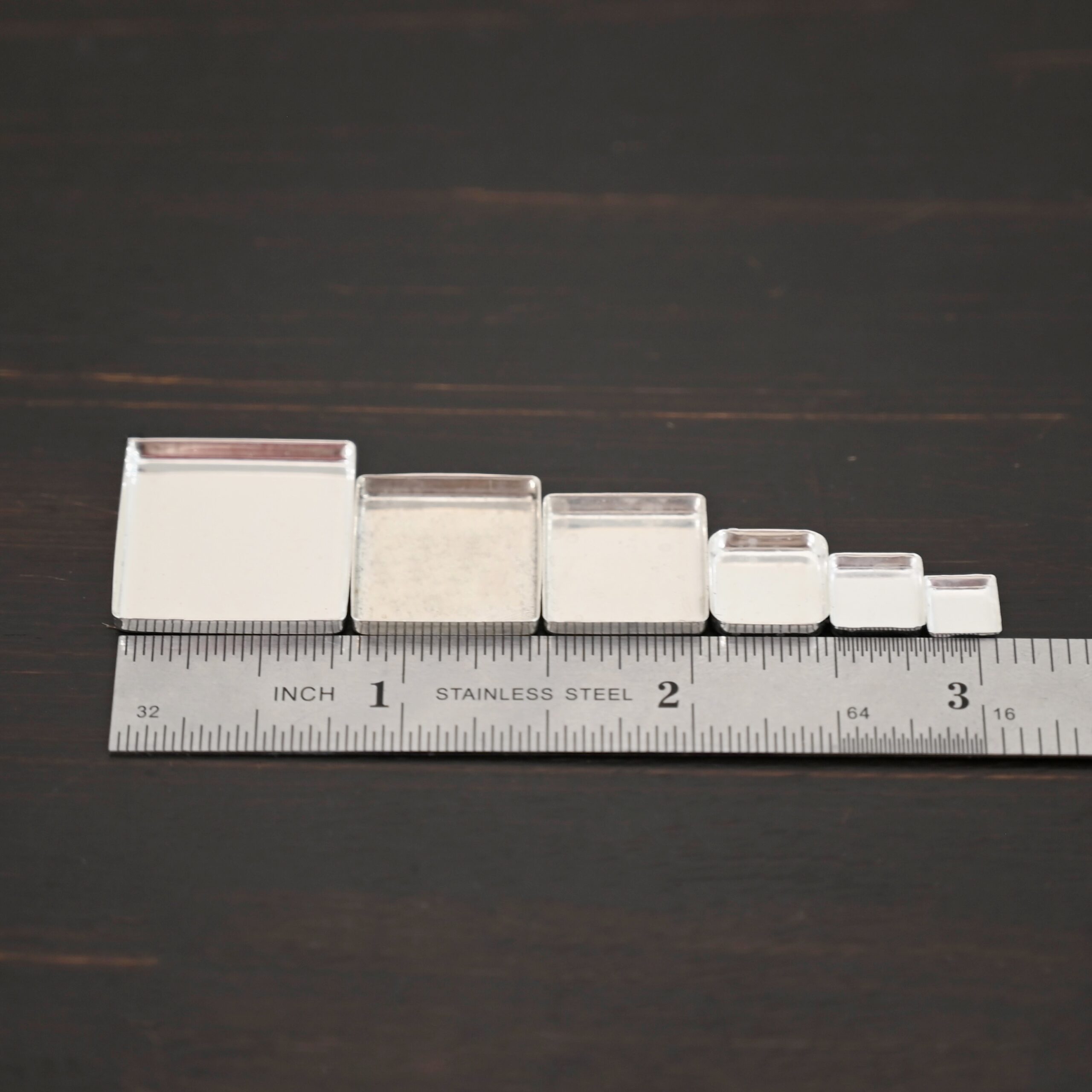 square bezel cups - shiny square bezel cups - shiny shown by ruler