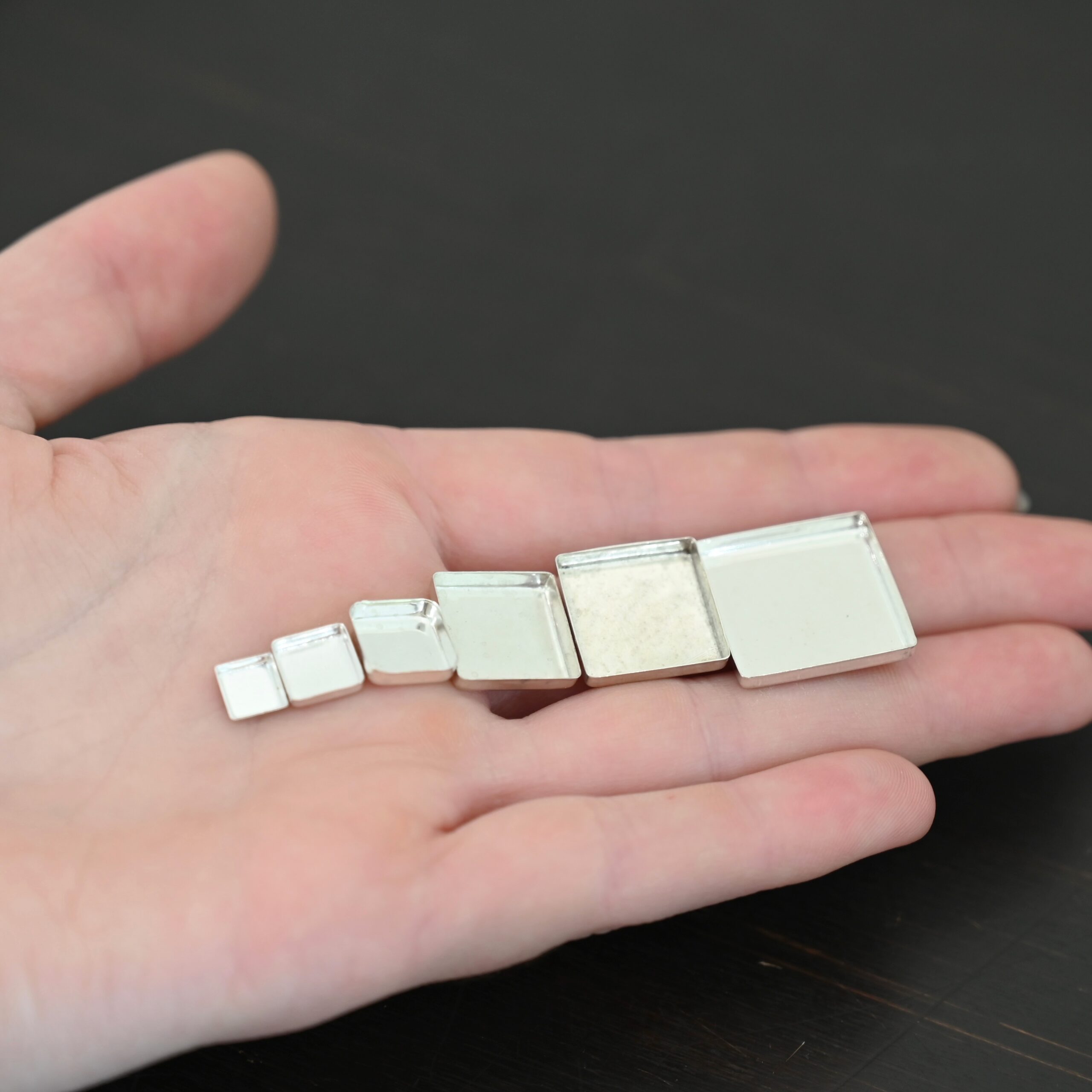 square bezel cups - shiny square bezel cups - shiny shown in hand