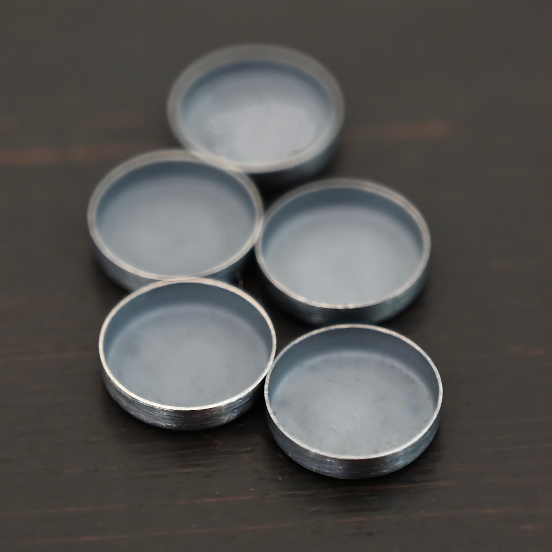 Round Bezel Cups - Oxidized shown on dark background