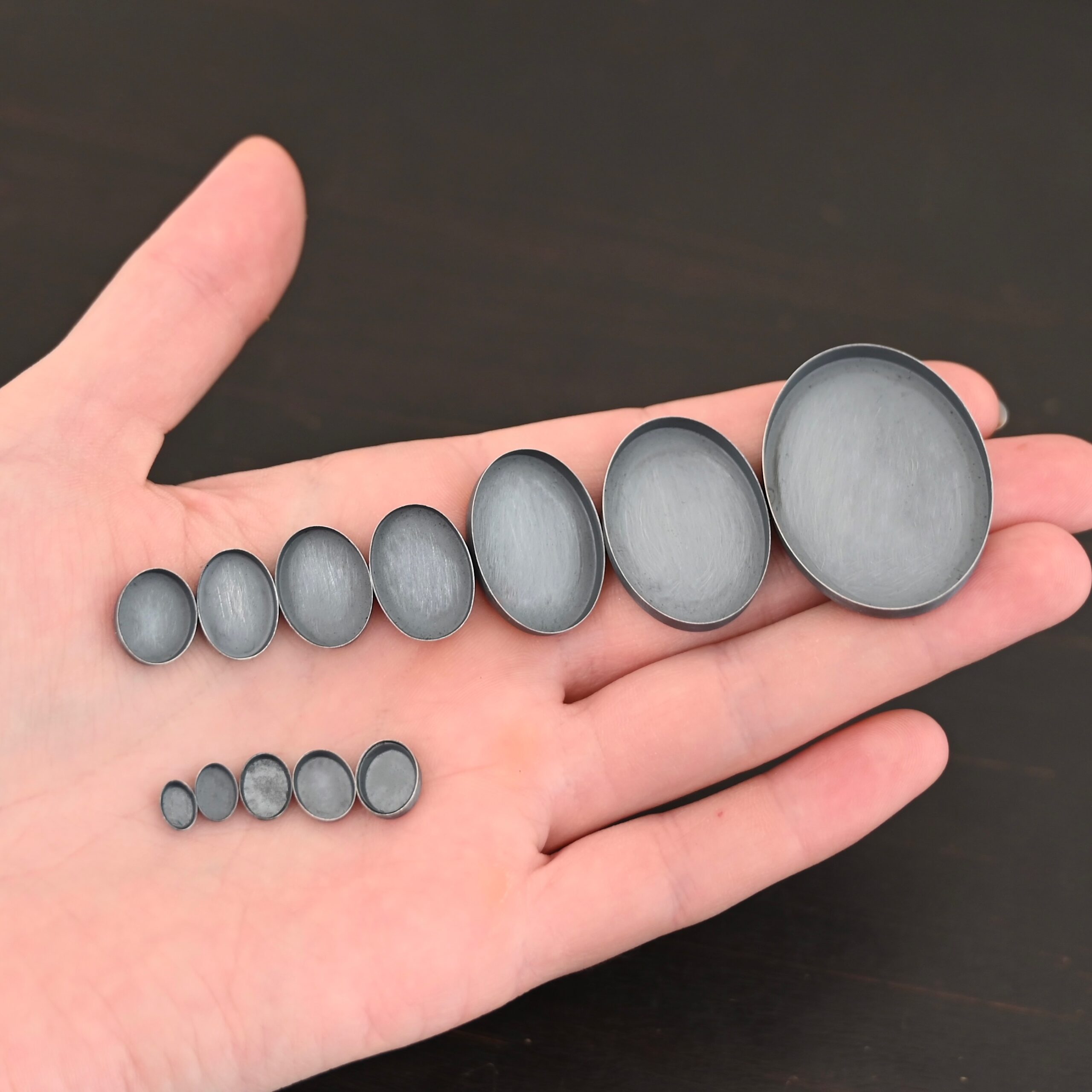 Oval Bezel Cups - oxidized shown in hand