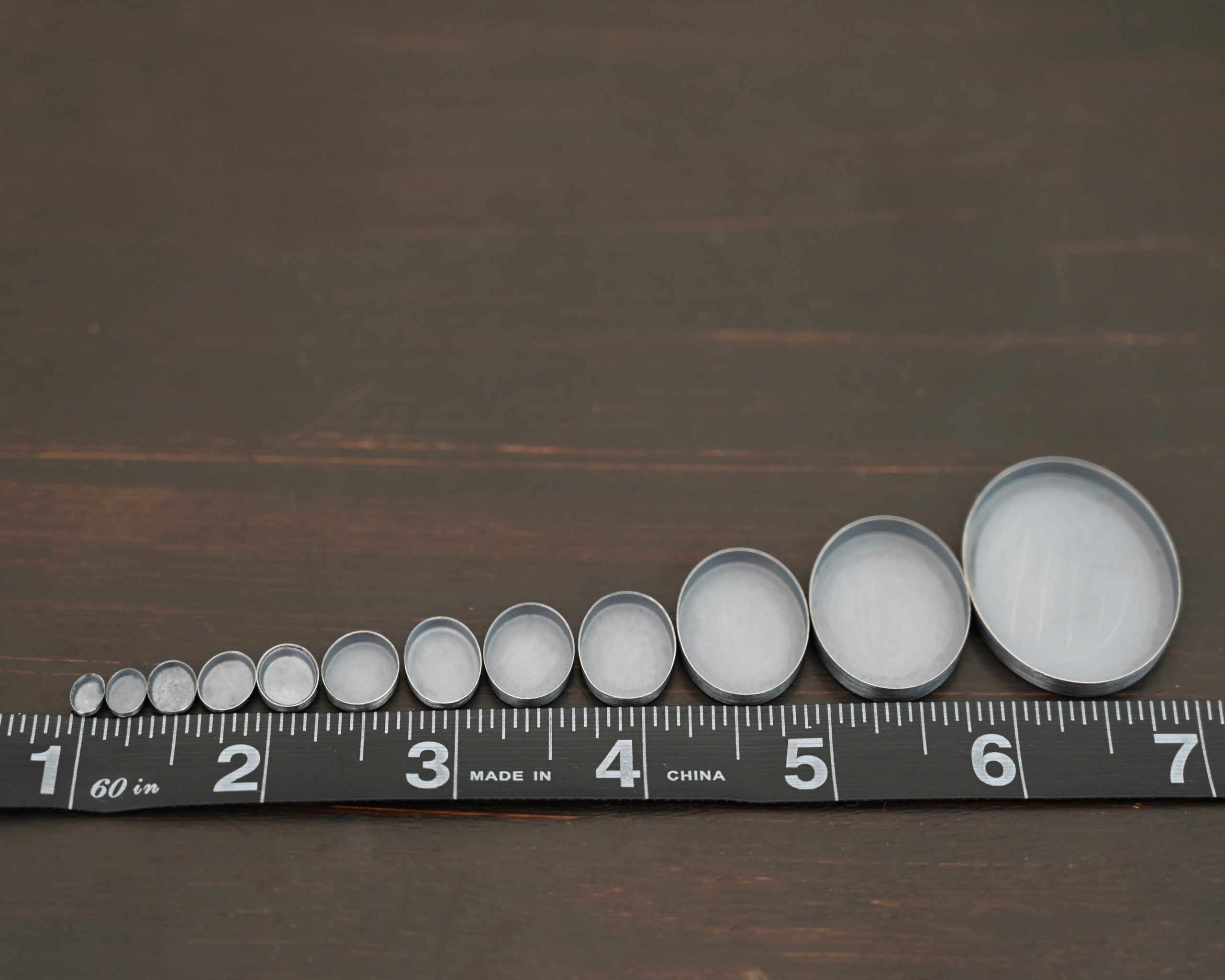 Oval Bezel Cups - oxidized shown by ruler
