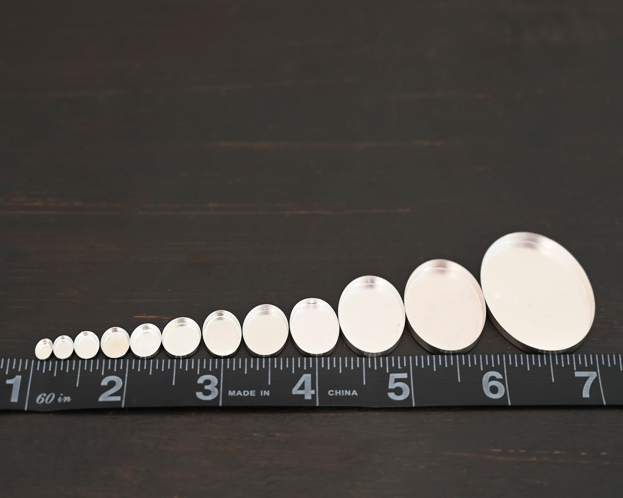 Oval Bezel Cups - shiny shown by ruler