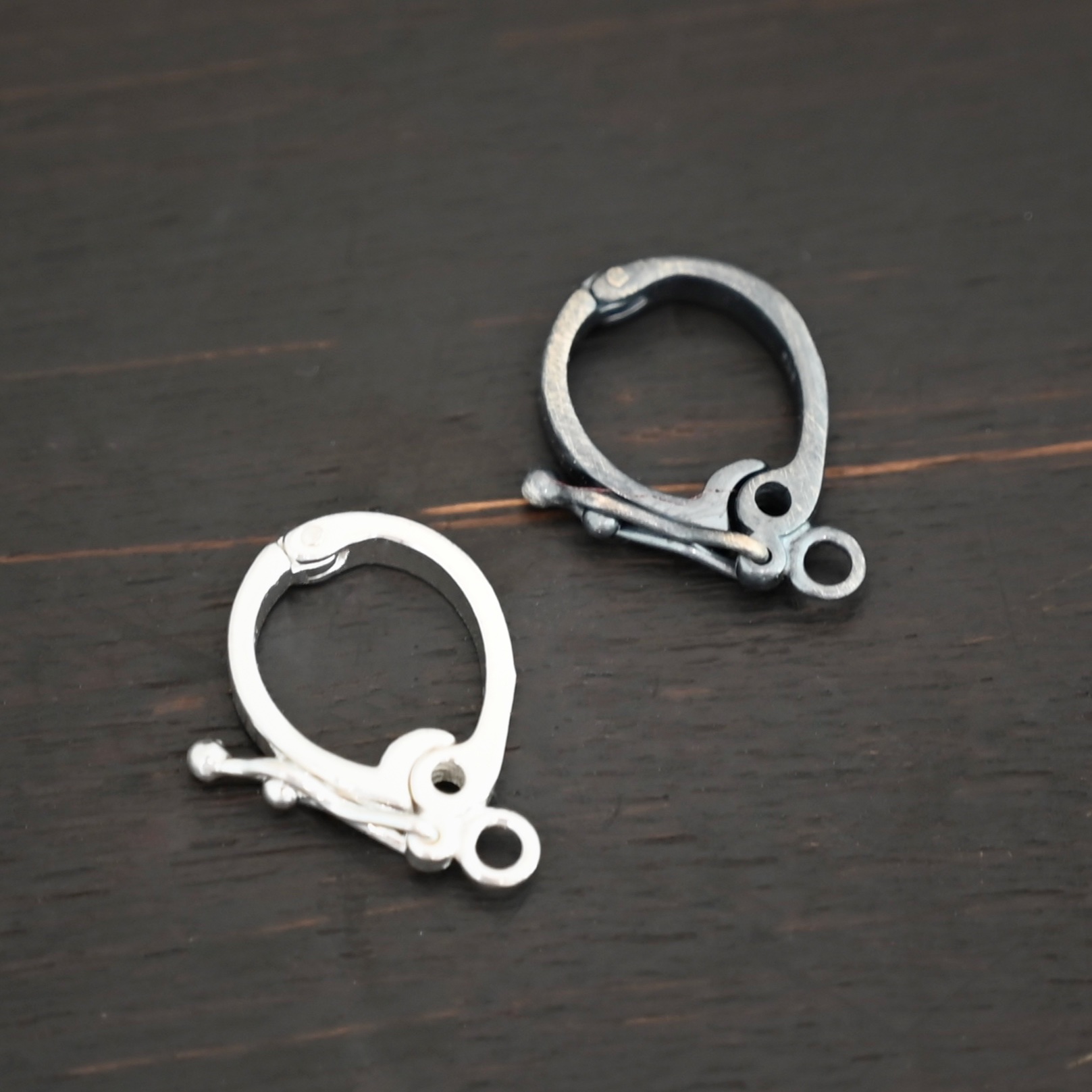 Silver Hinged Bail shown in dark background