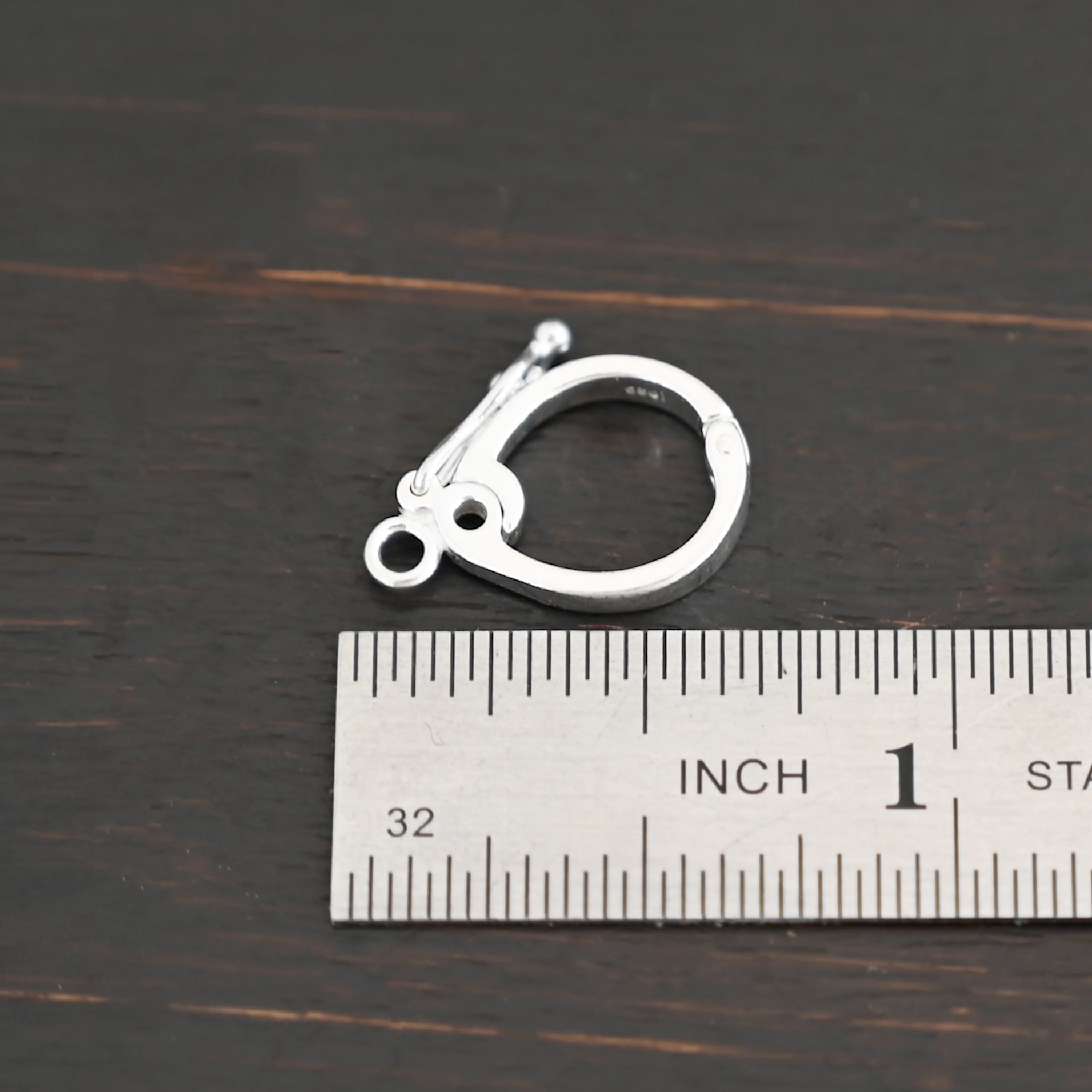 Silver Hinged Bail - shiny shown by ruler