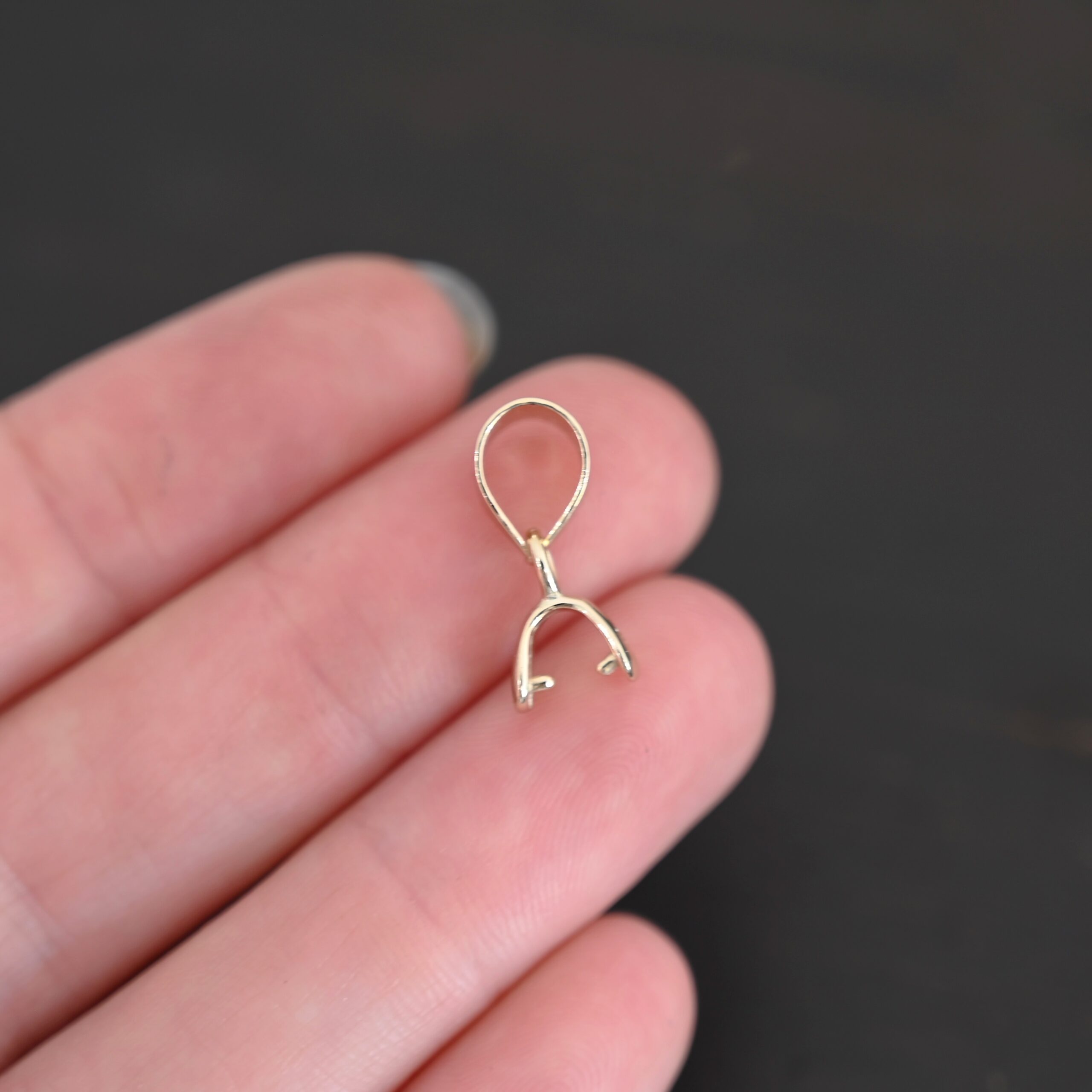 Gold Plated Pinch Bails - 5x6mm shown in hand