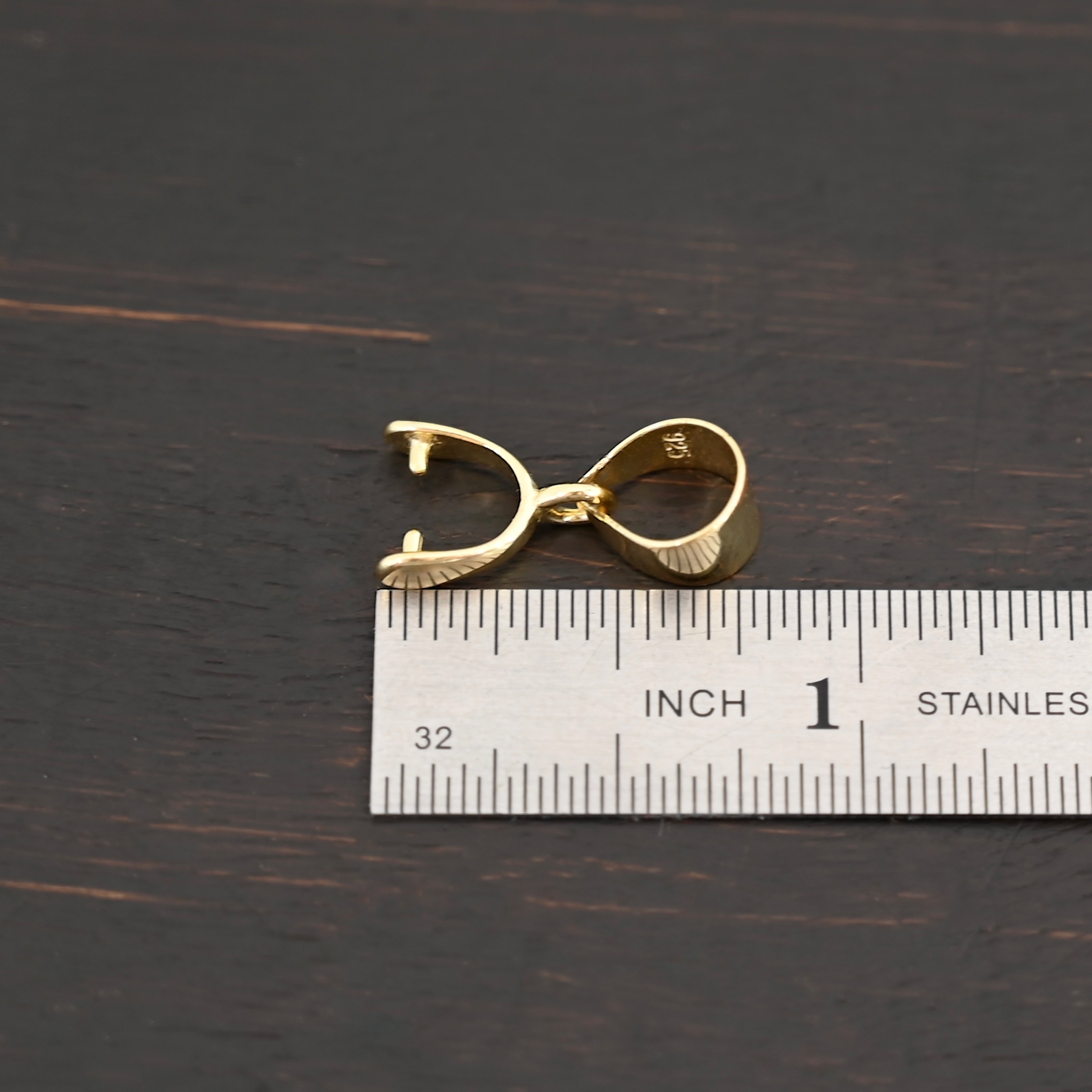 Gold Plated Pinch Bails - 7x7mm shown by ruler