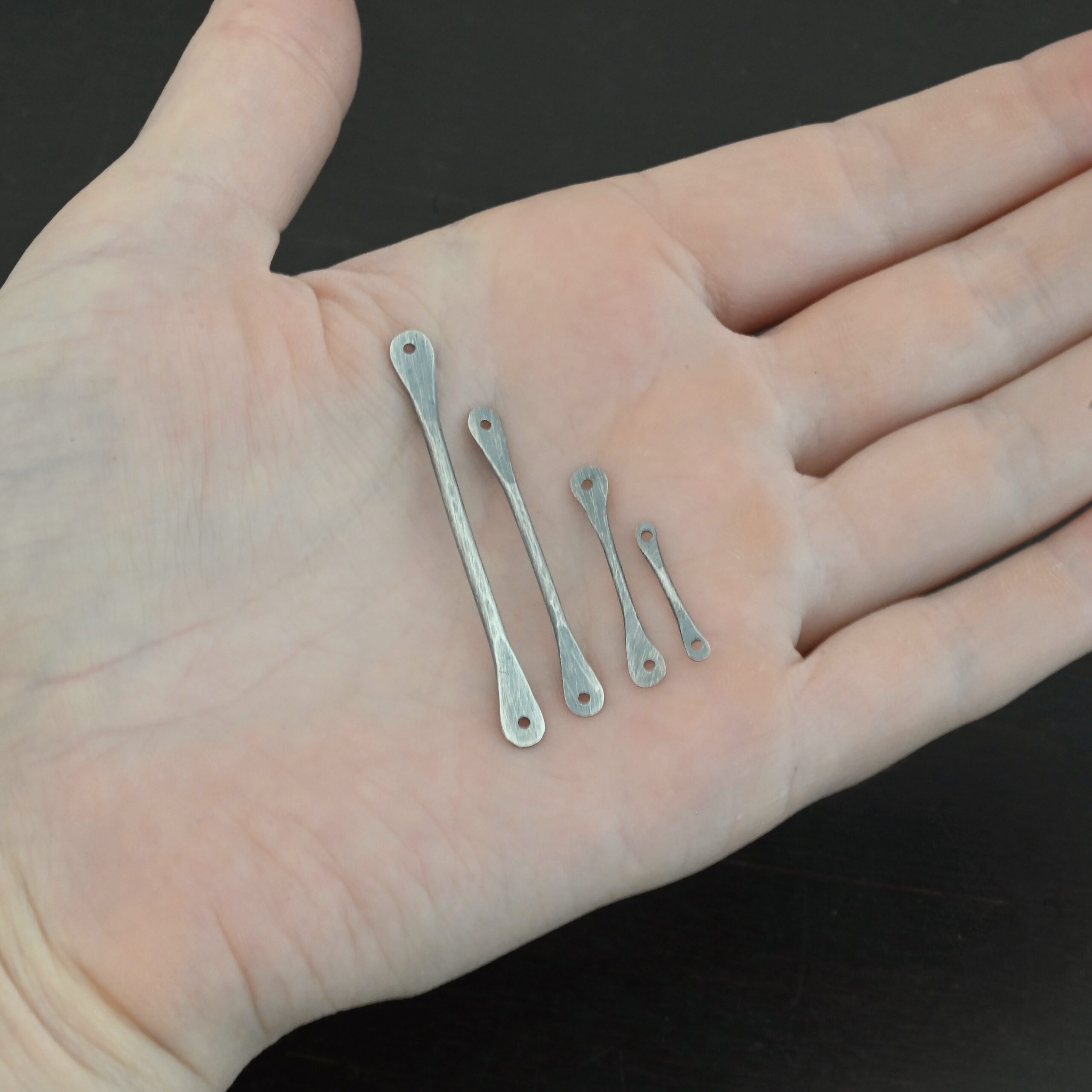 Hammered stick - oxidized shown in hand