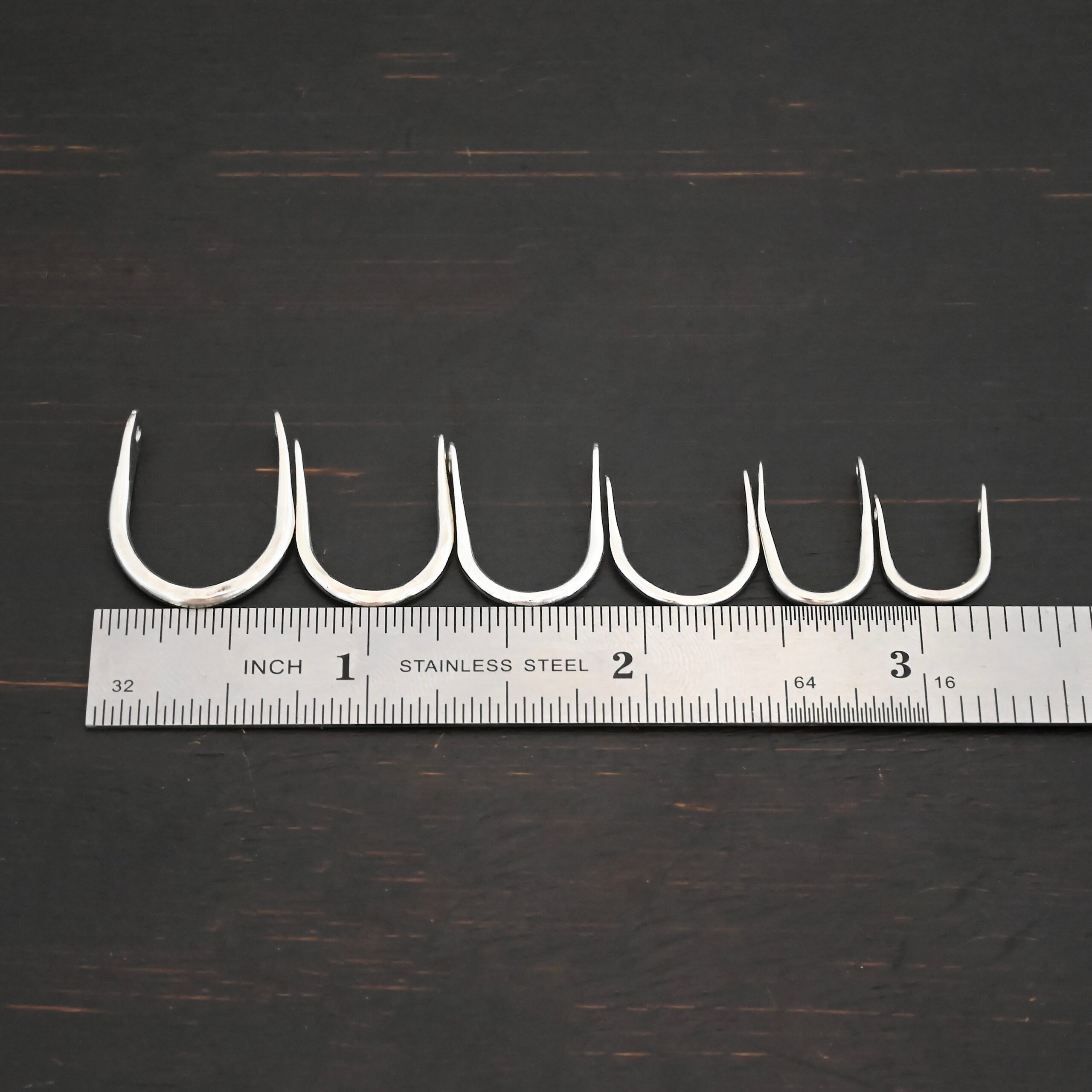 U Shaped finding - shiny hammered shown by ruler