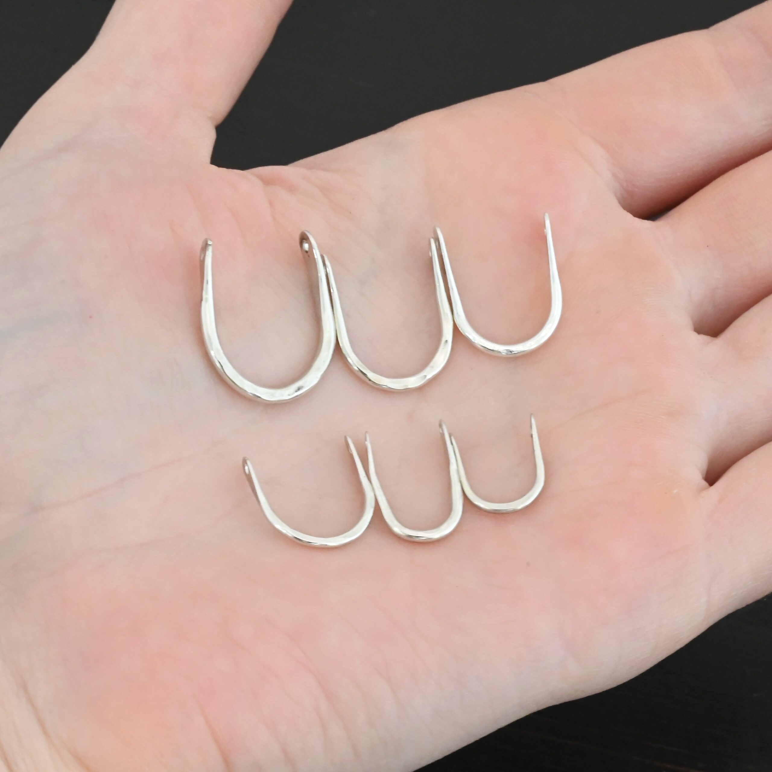 U Shaped finding - shiny hammered shown in hand