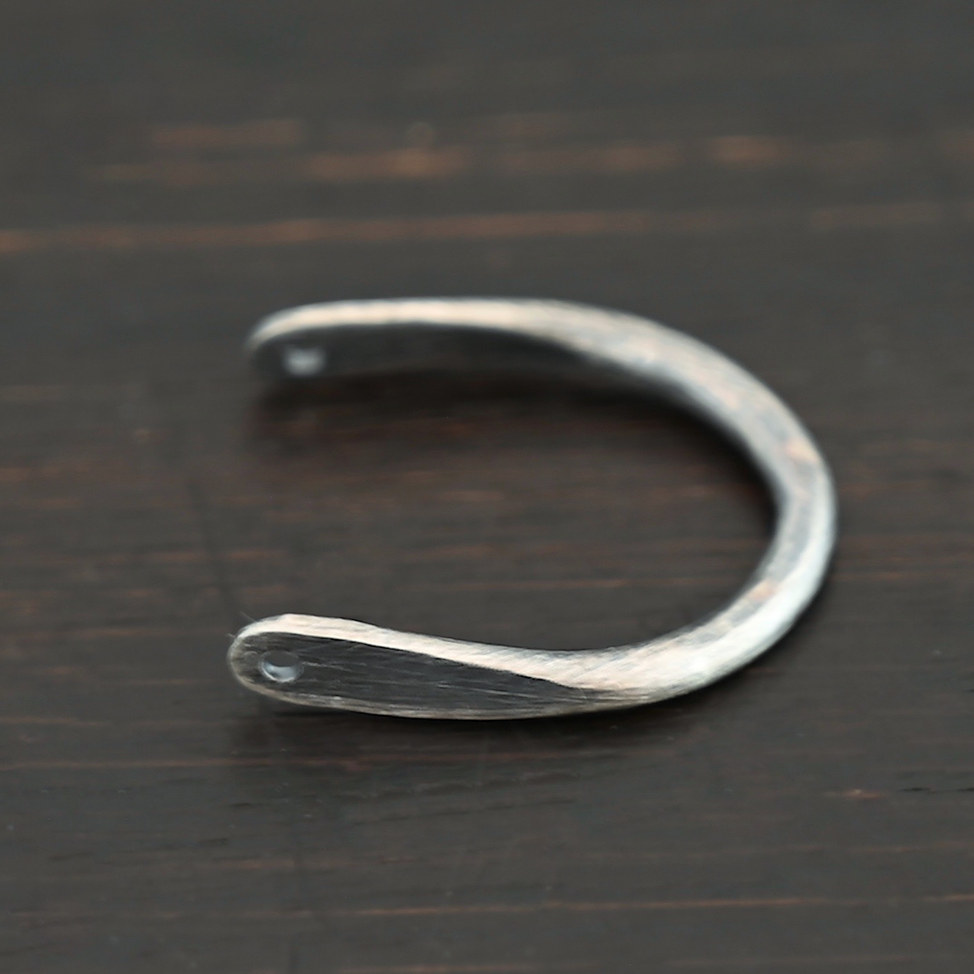 U Shaped finding - oxidized hammered shown on dark background