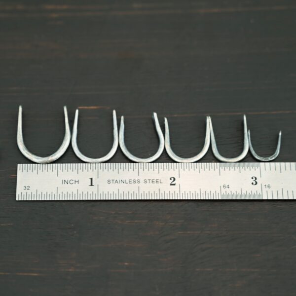 U Shaped finding - oxidized hammered shown by ruler