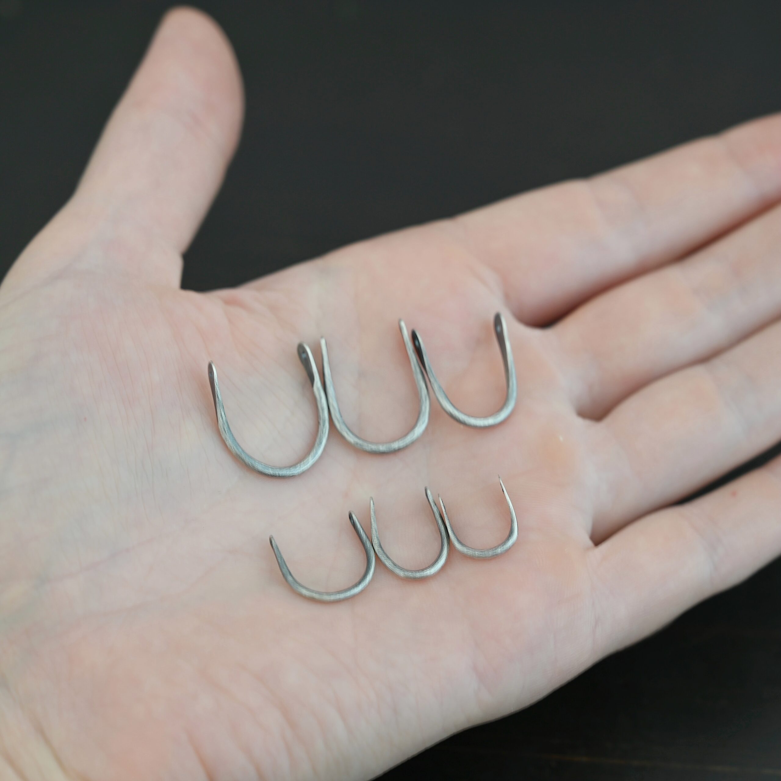 U Shaped finding - oxidized smooth shown in hand