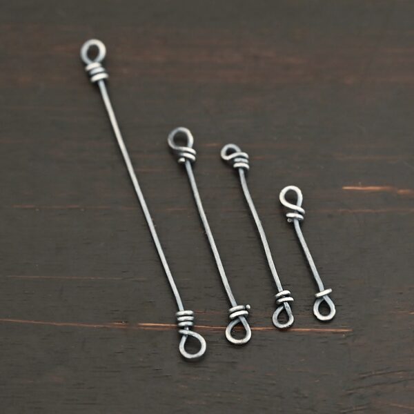 Stick Loop Finding - oxidized shown on dark background