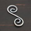S Shaped Finding - oxidized shown on dark background