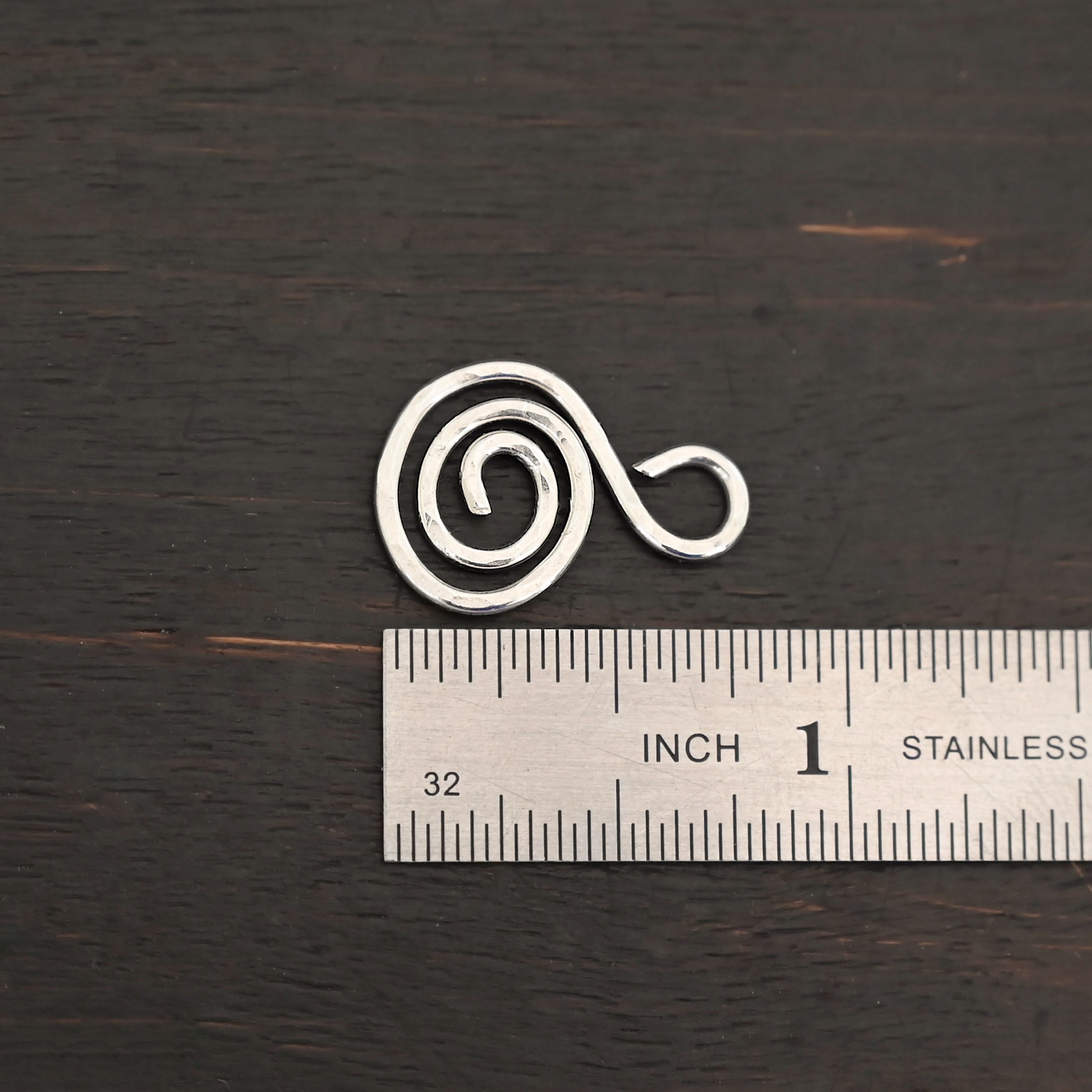 S Shaped Finding - shiny hammered shown by ruler