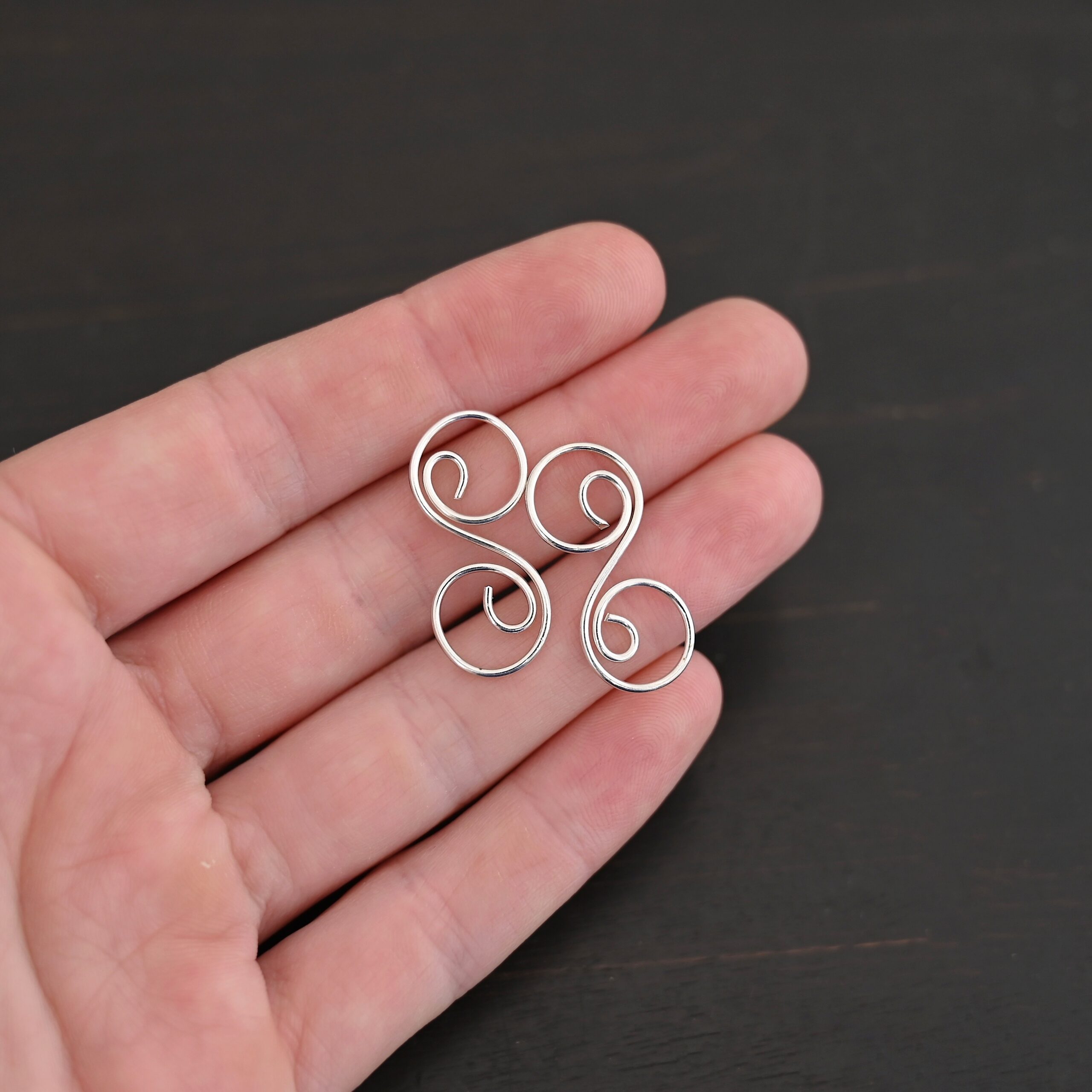 Paired S Shaped Finding - shiny smooth shown in hand