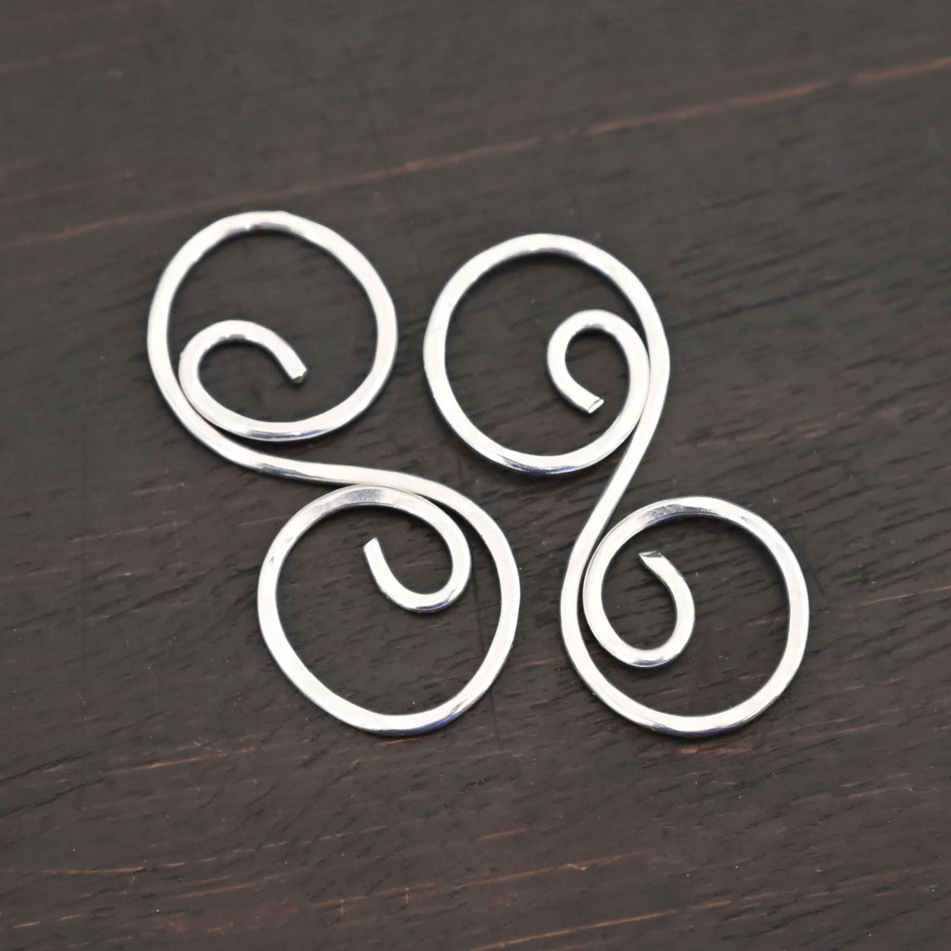 Paired S Shaped Finding - shiny hammered shown on dark background