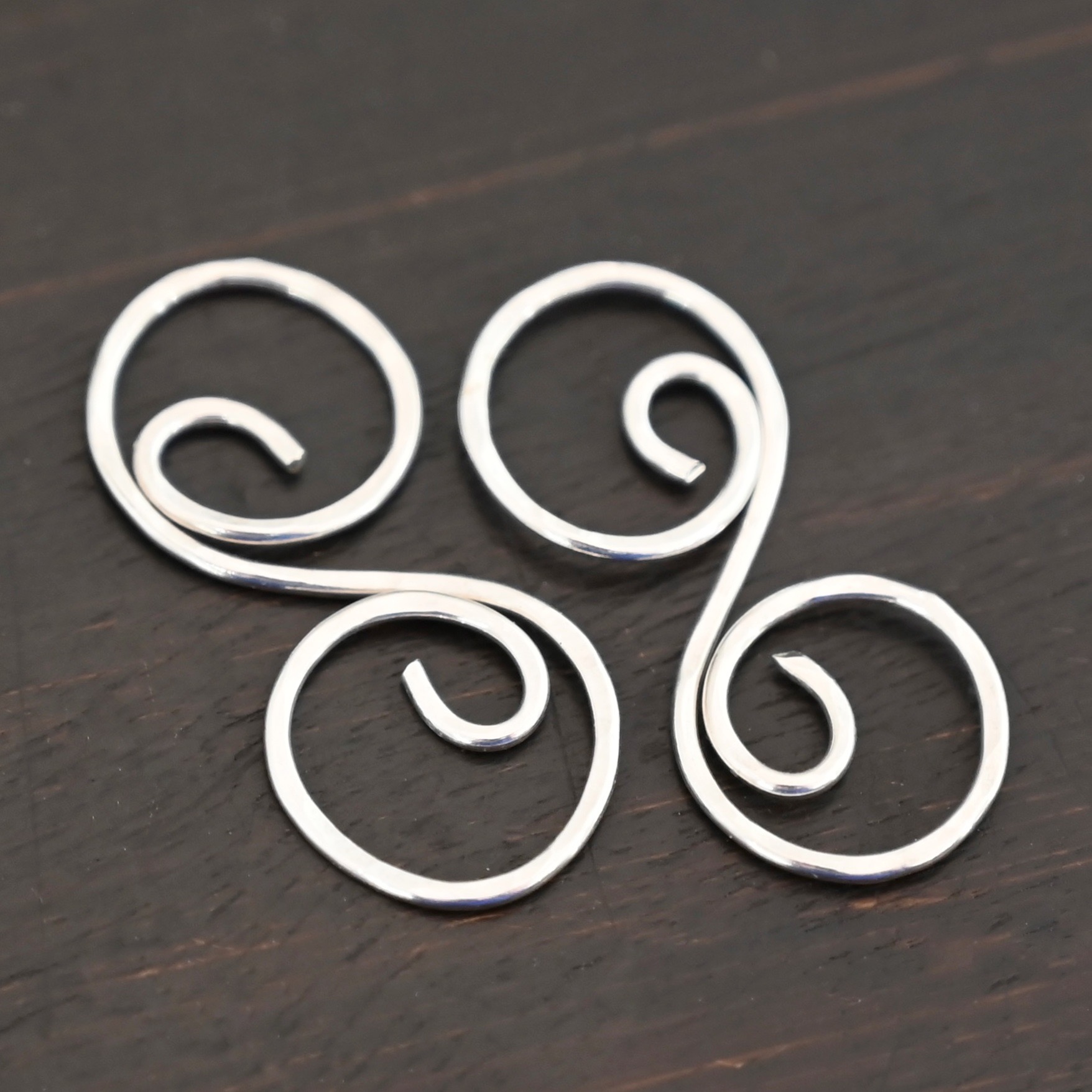 Paired S Shaped Finding - shiny hammered shown on dark background