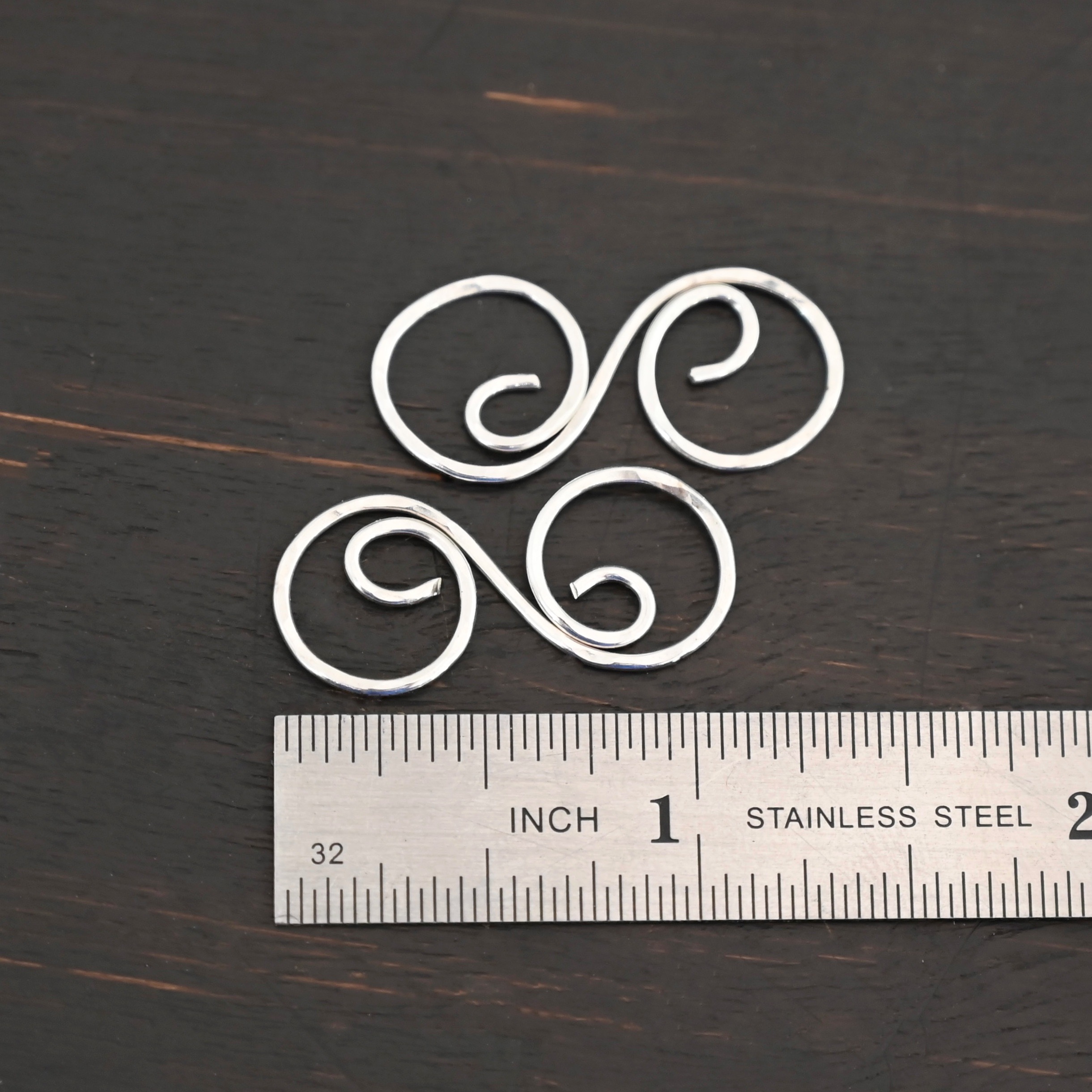 Paired S Shaped Finding - shiny hammered shown by ruler