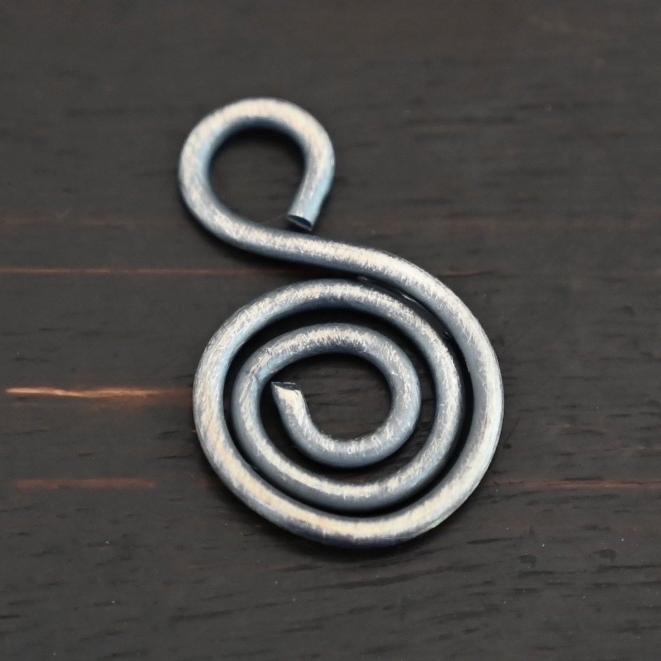 S Shaped Finding - oxidized smooth shown in dark background