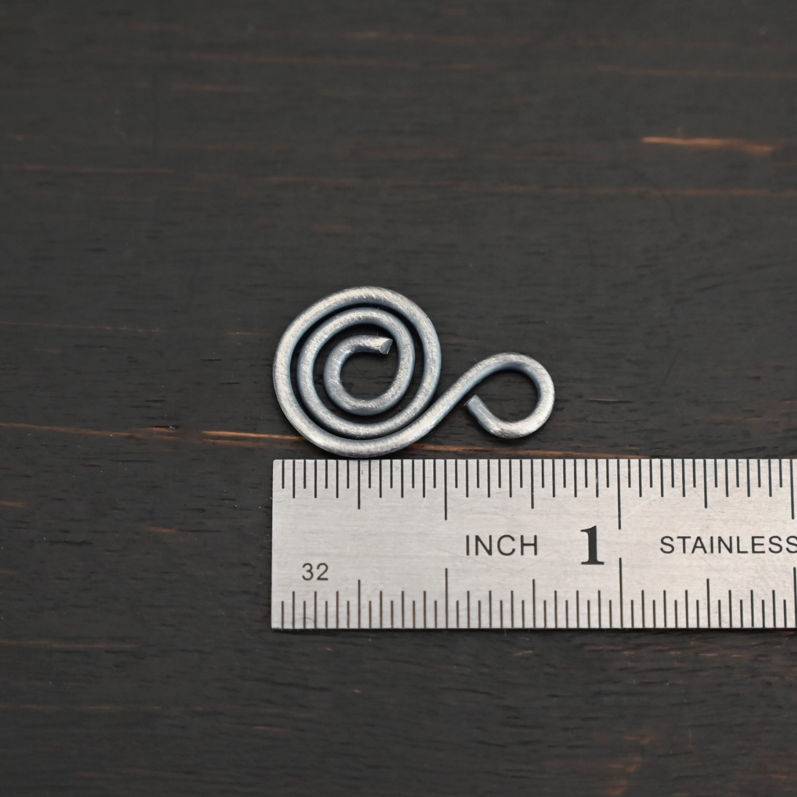 S Shaped Finding - oxidized smooth shown by ruler