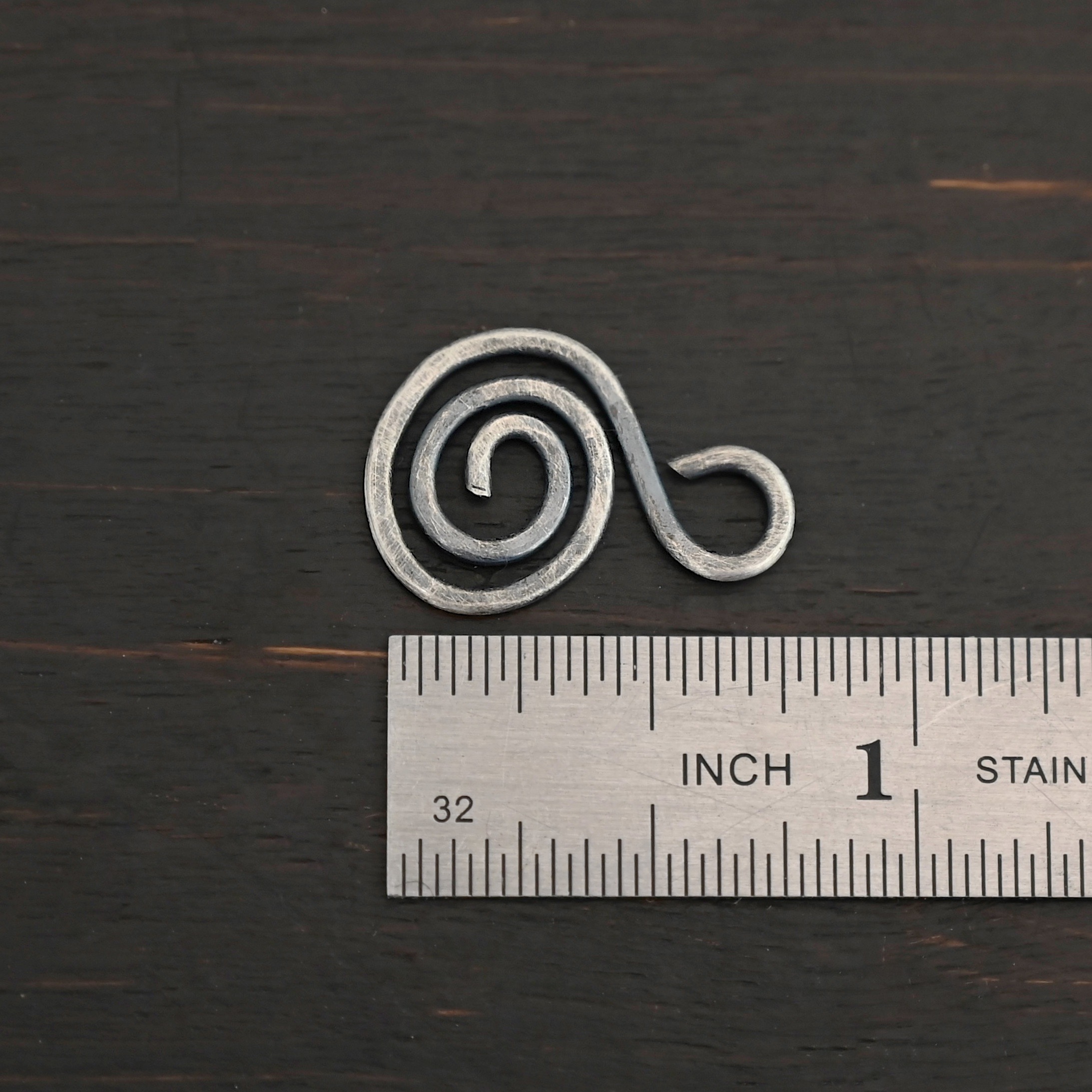 S Shaped Finding - oxidized hammered shown by ruler