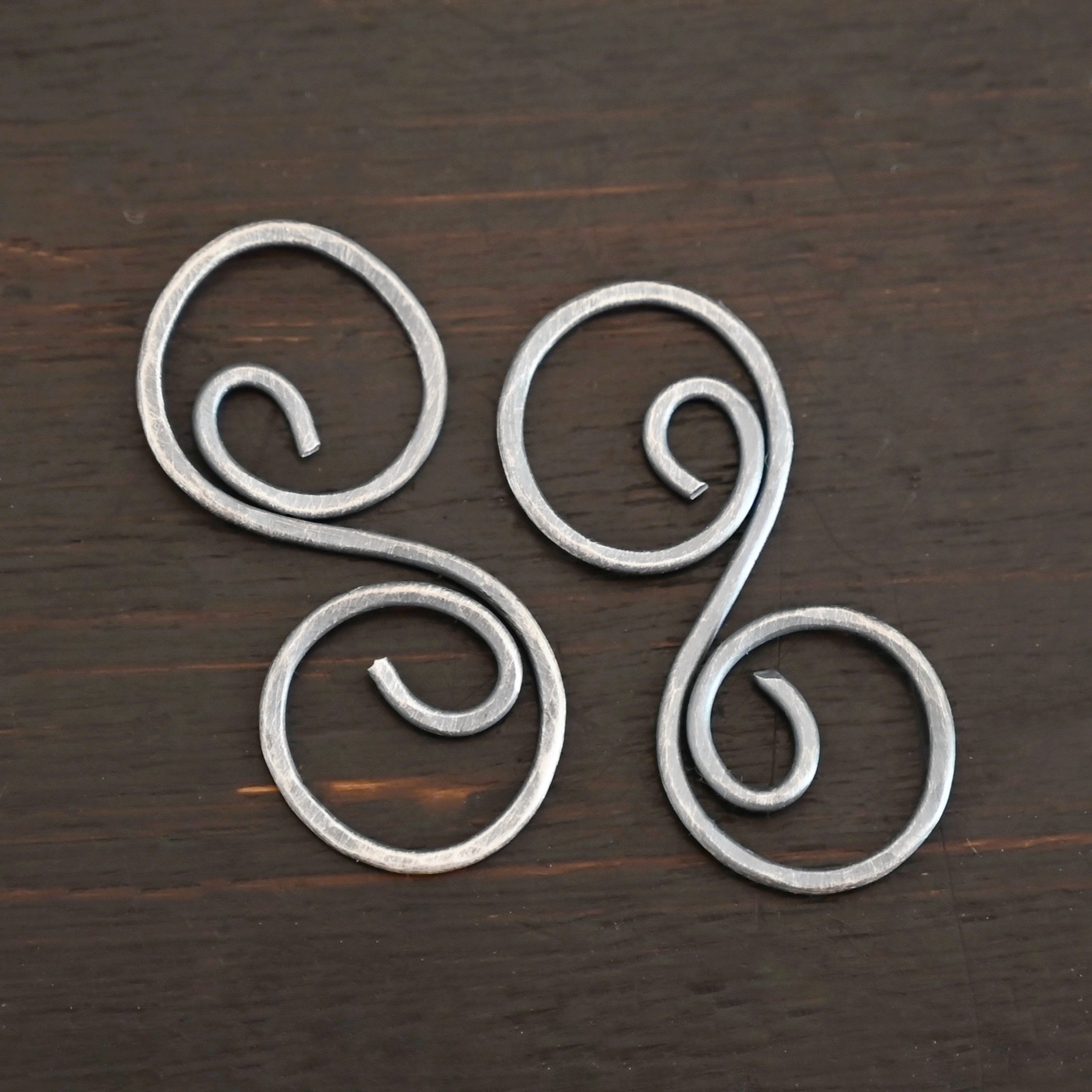 Paired S Shaped Finding - oxidized hammered shown on dark background