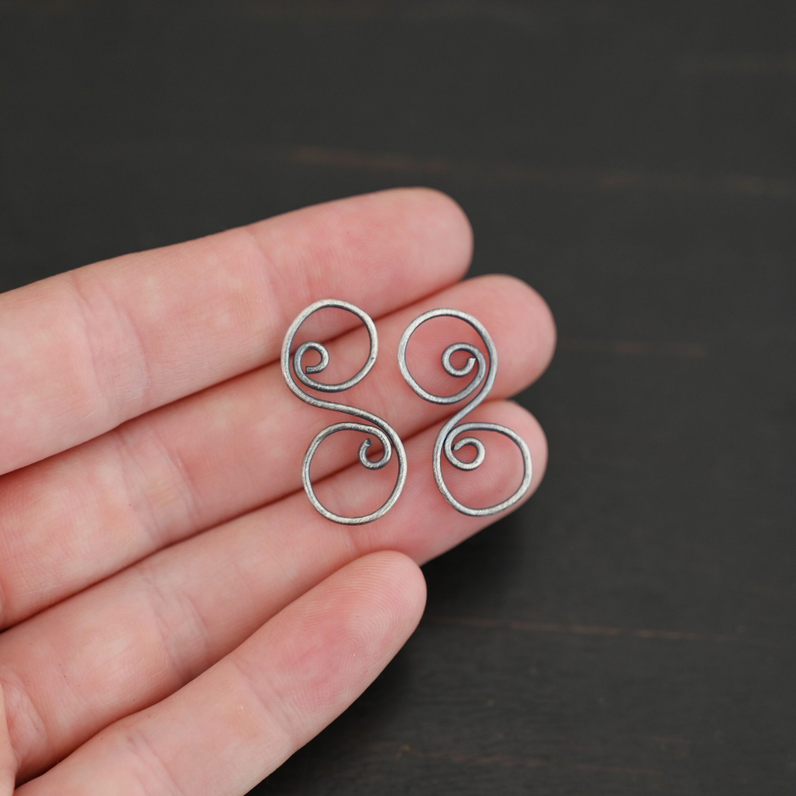 Paired S Shaped Finding - oxidized smooth shown in hand