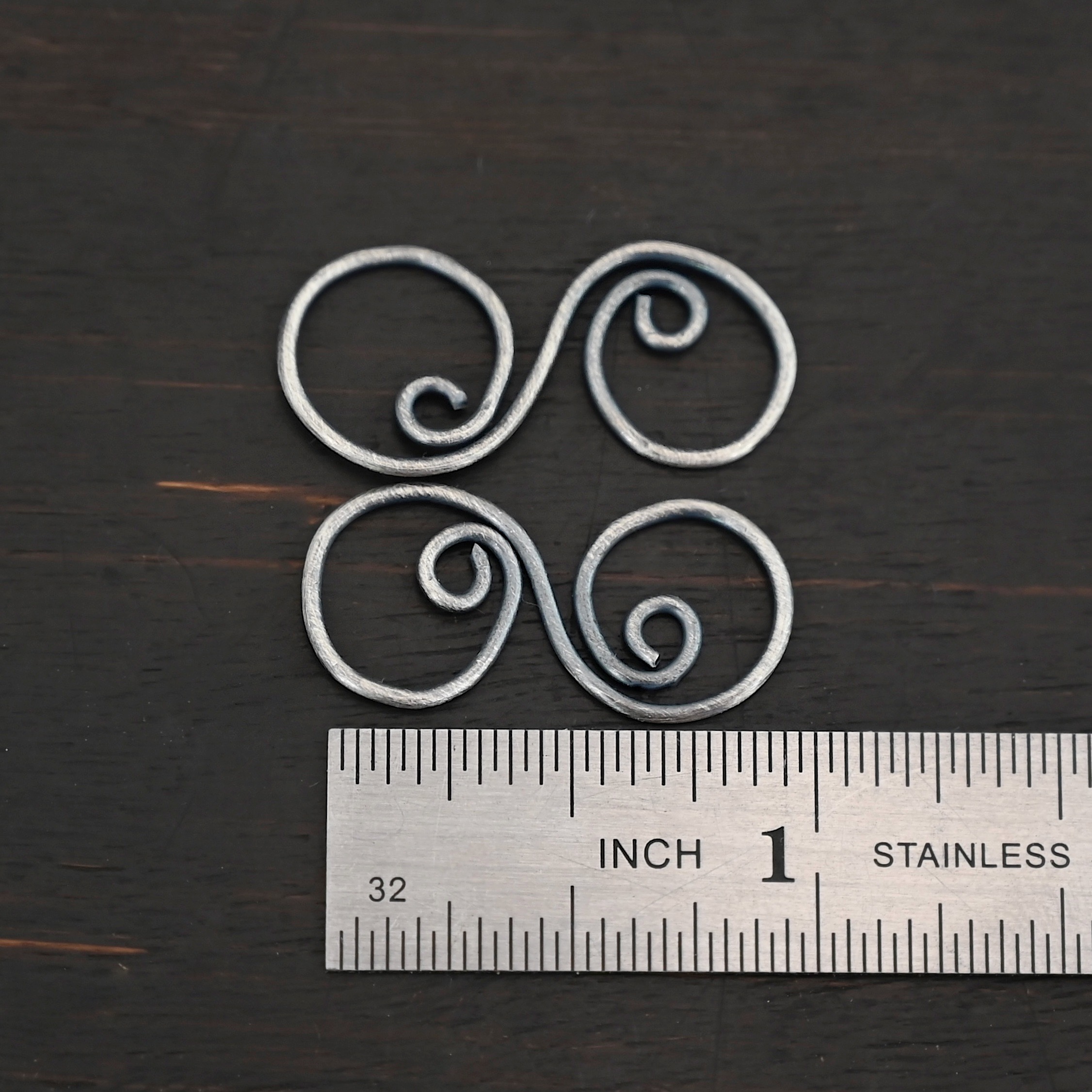 Paired S Shaped Finding - oxidized smooth shown by ruler