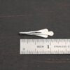 Necklace Component - shiny shown by ruler