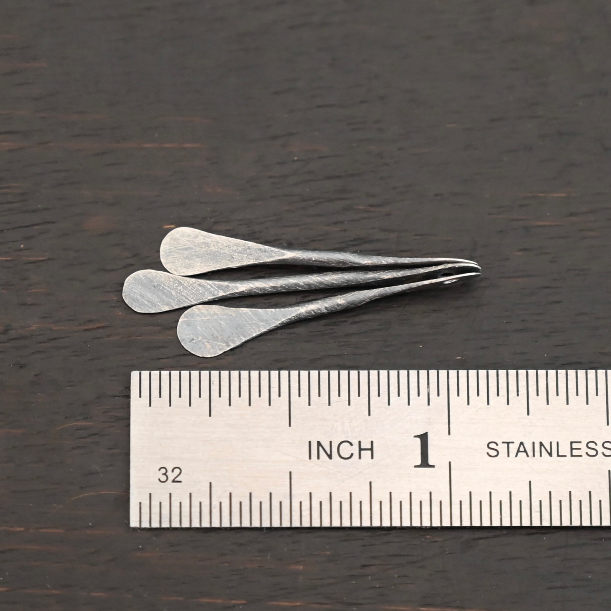 Necklace Component - oxidized shown by ruler