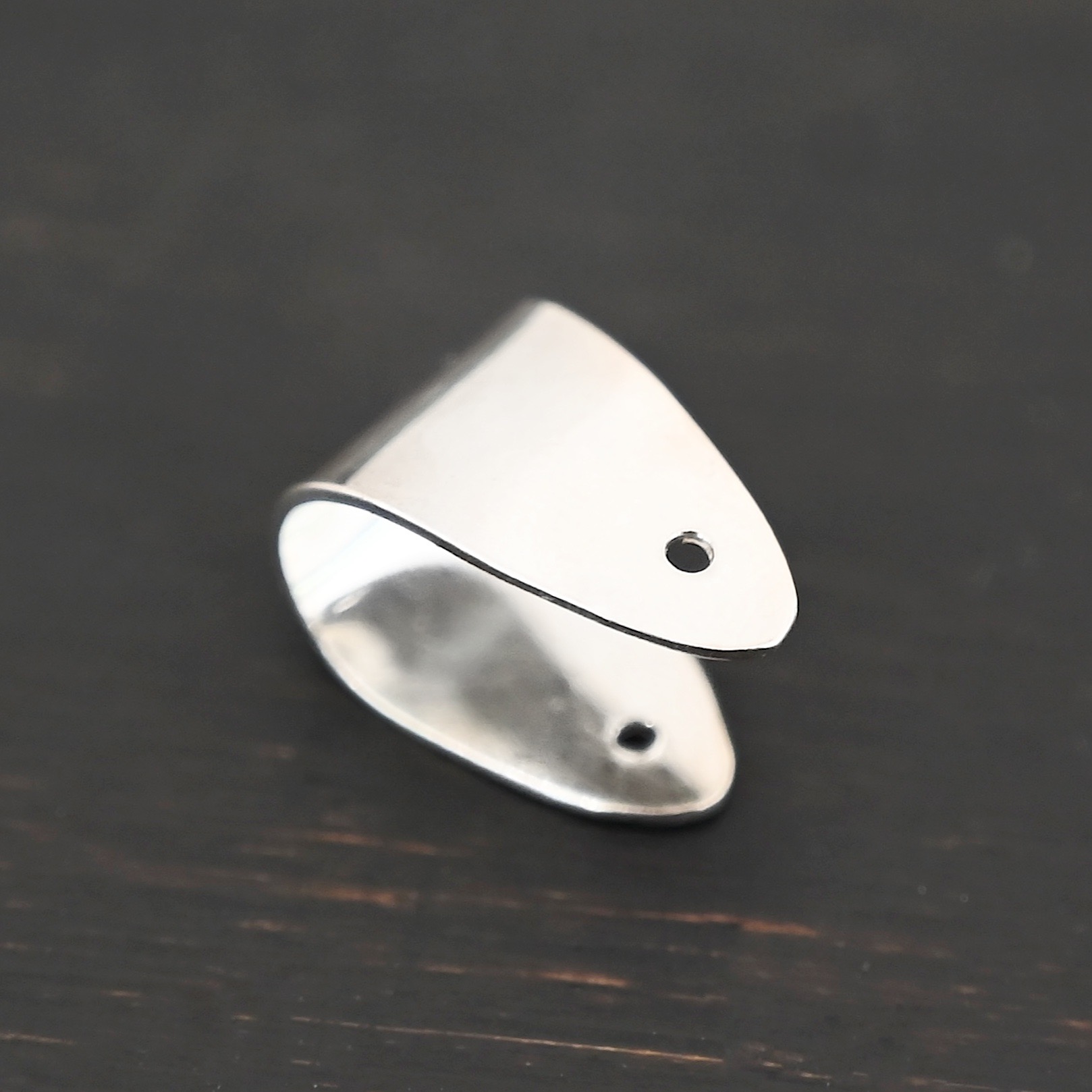 Handmade Pinch Bail - shiny plain shown in dark background