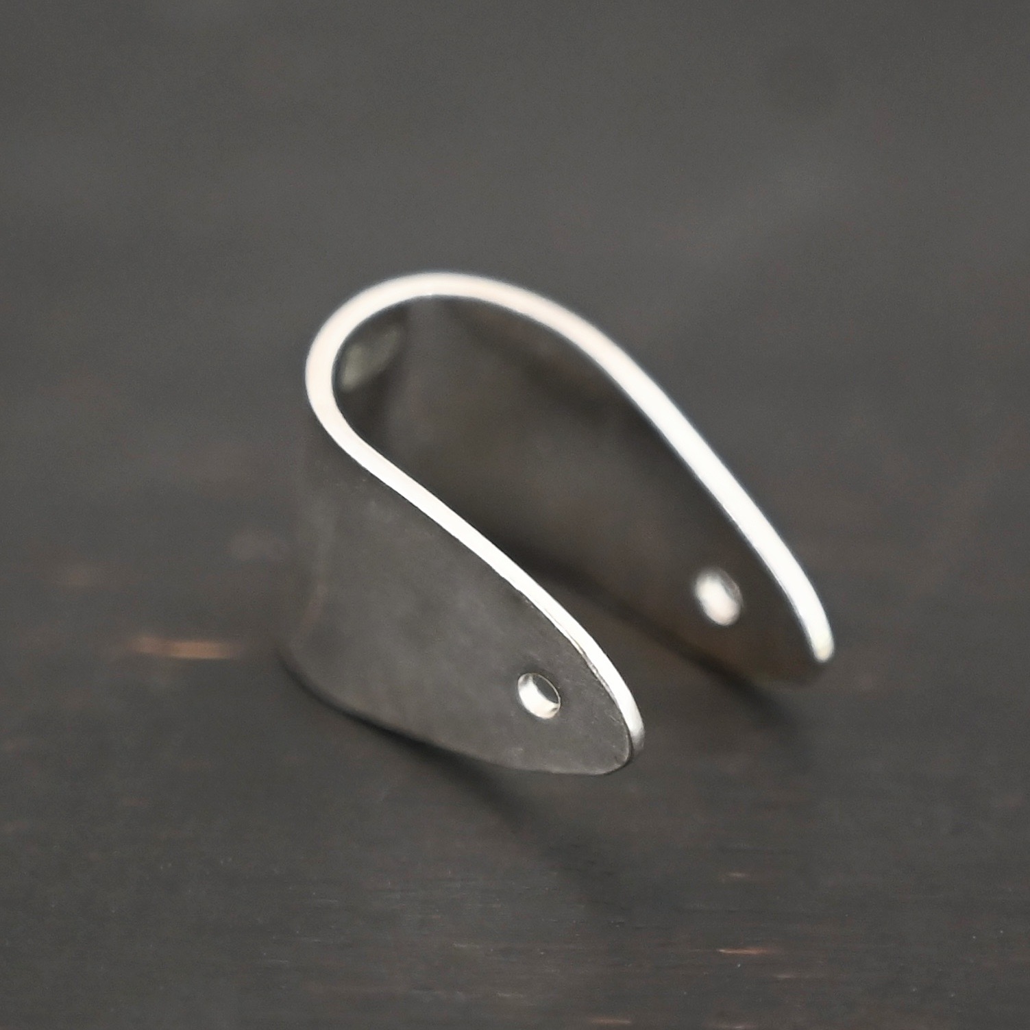 Handmade Pinch Bail - shiny plain shown on dark background