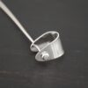 Handmade Pinch Bail - shiny headpin shown on dark background