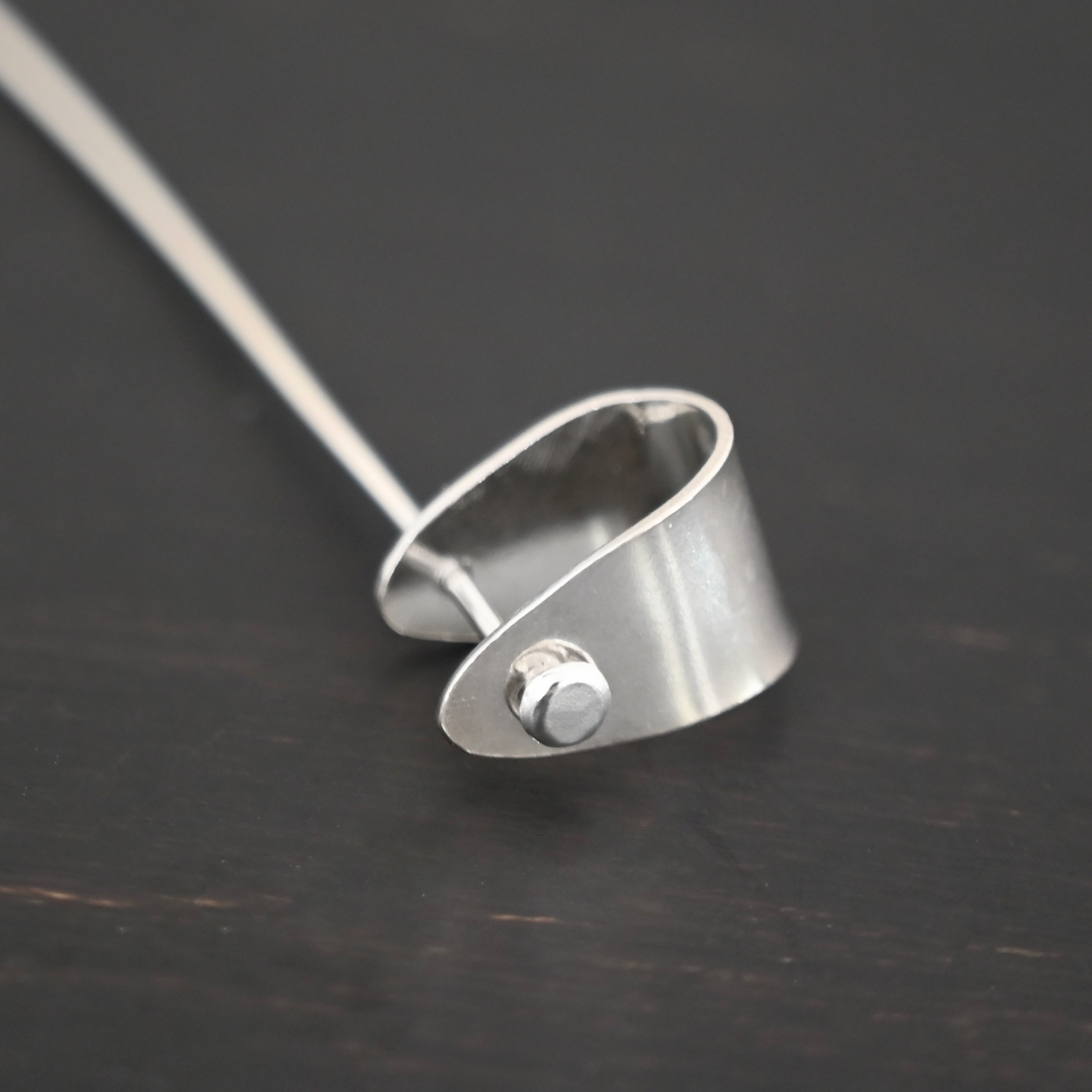 Handmade Pinch Bail - shiny headpin shown on dark background