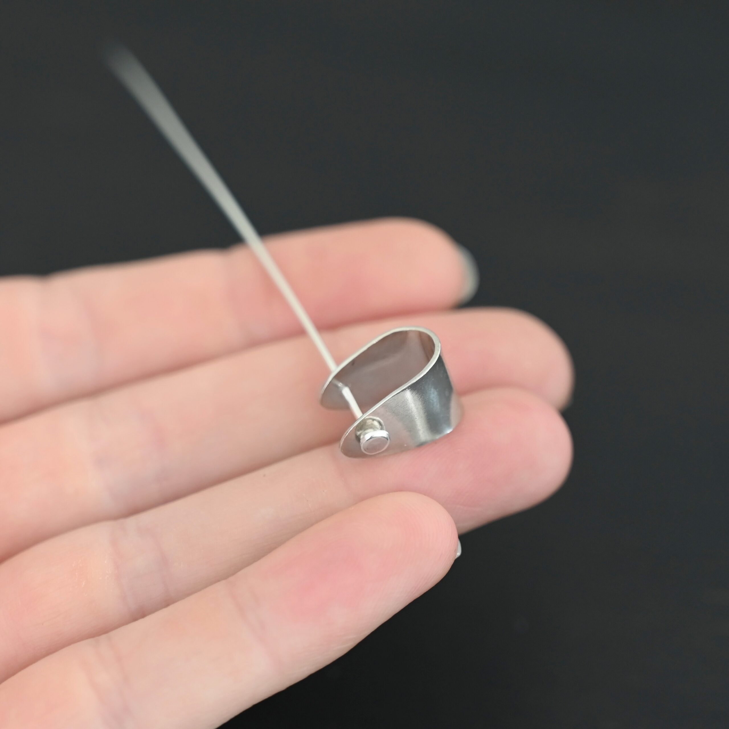 Handmade Pinch Bail - shiny headpin shown in hand