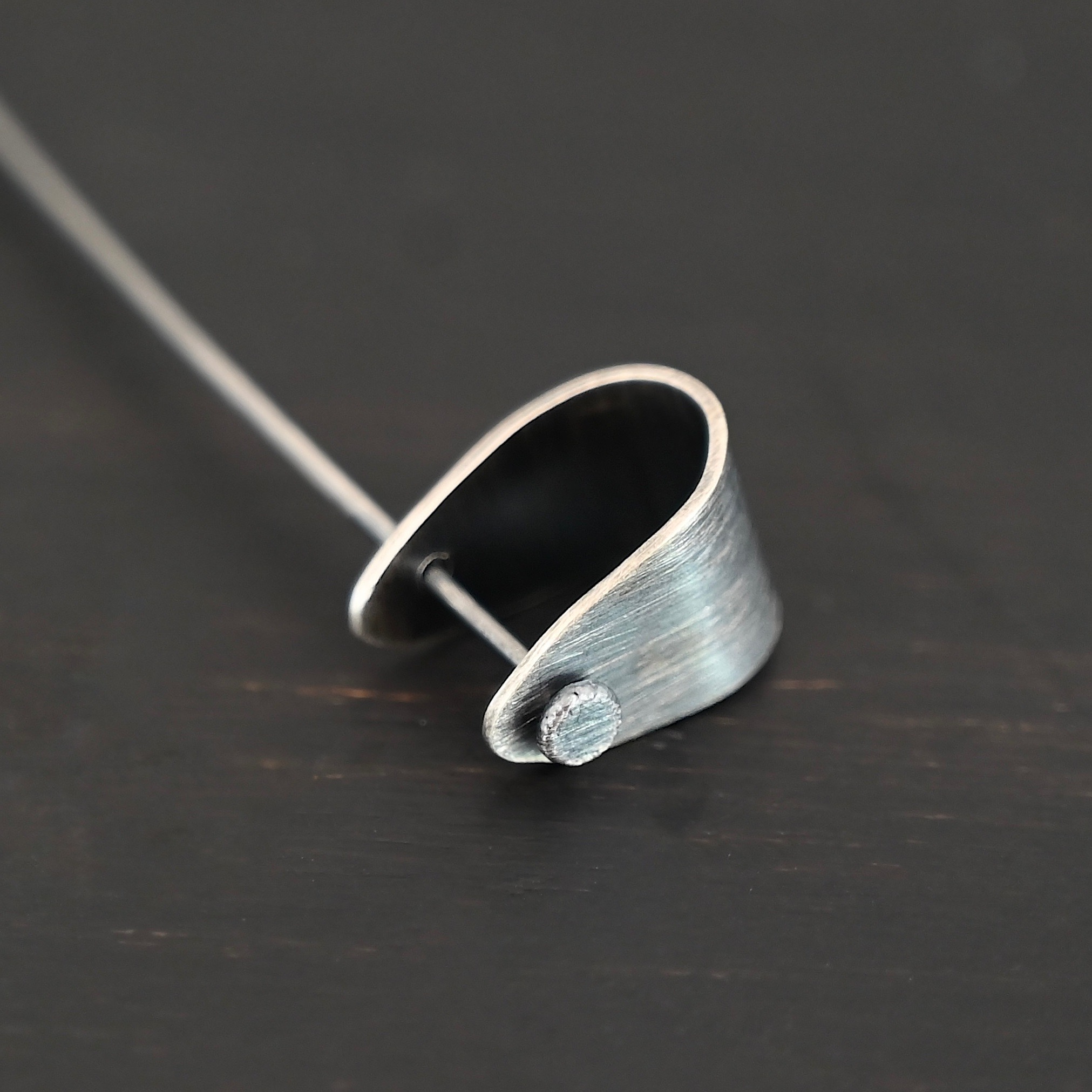 Handmade Pinch Bail - oxidized with headpin shown on dark background