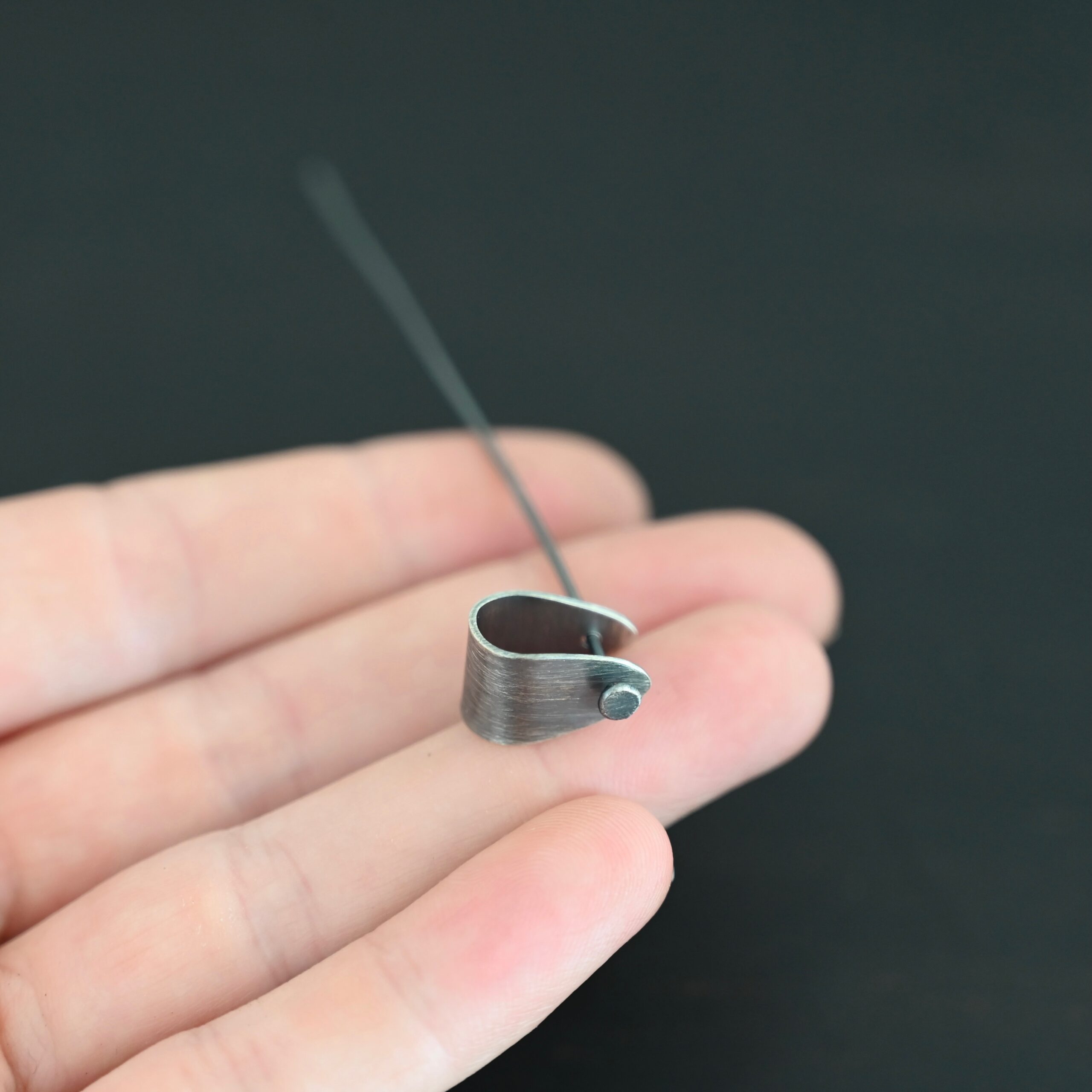 Handmade Pinch Bail - oxidized with headpin shown in hand