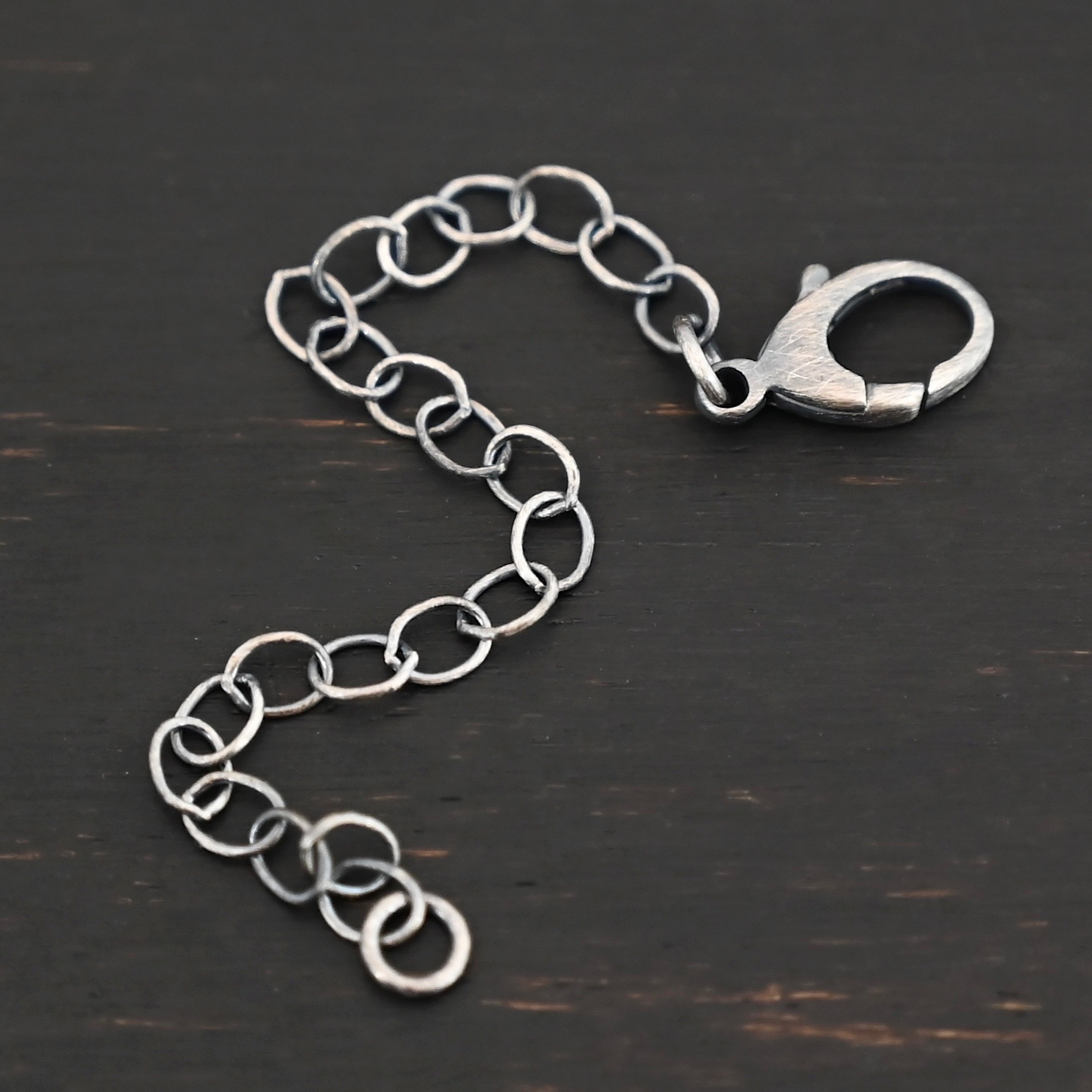 Everett Extension - oxidized large shown on dark background